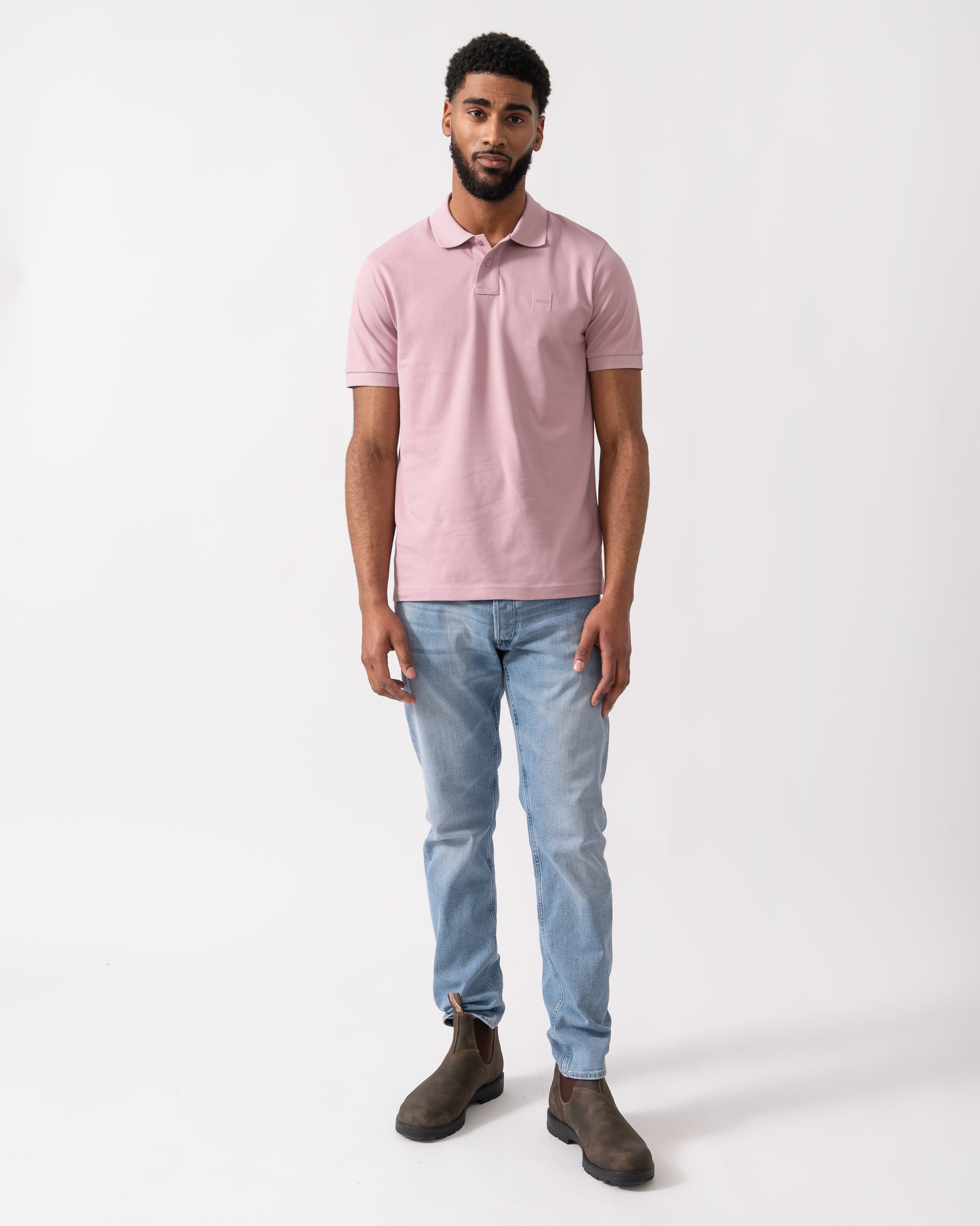 full length shot of a model wearing a BOSS Orange Passenger Mens Stretch-Cotton Slim-Fit Polo Shirt with Logo Patch in Light/Pastel Purple