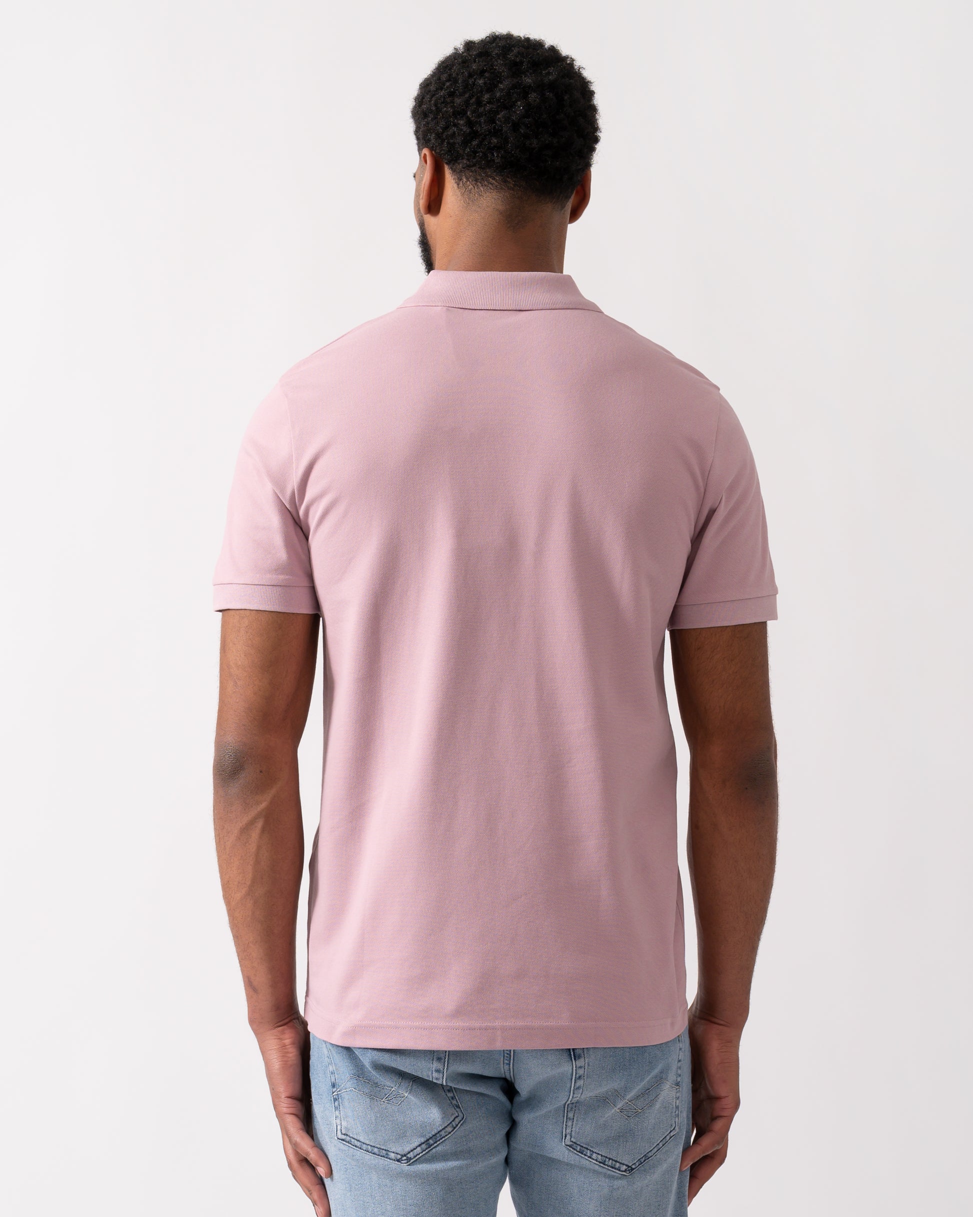 back shot of a model wearing a BOSS Orange Passenger Mens Stretch-Cotton Slim-Fit Polo Shirt with Logo Patch in Light/Pastel Purple