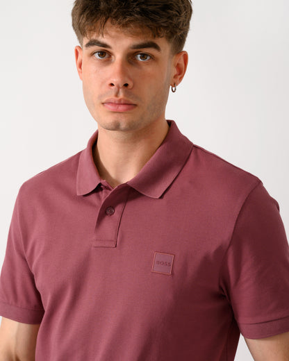 close up shot of a model wearing a BOSS Orange Passenger Mens Stretch-Cotton Slim-Fit Polo Shirt with Logo Patch in Medium Red 618