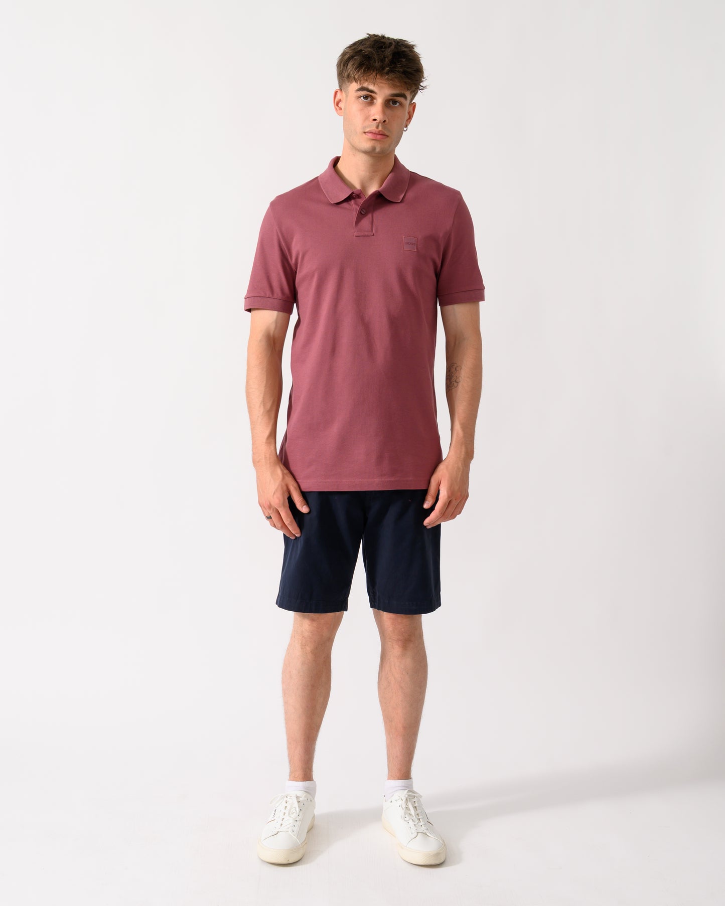 full length shot of a model wearing a BOSS Orange Passenger Mens Stretch-Cotton Slim-Fit Polo Shirt with Logo Patch in Medium Red 618