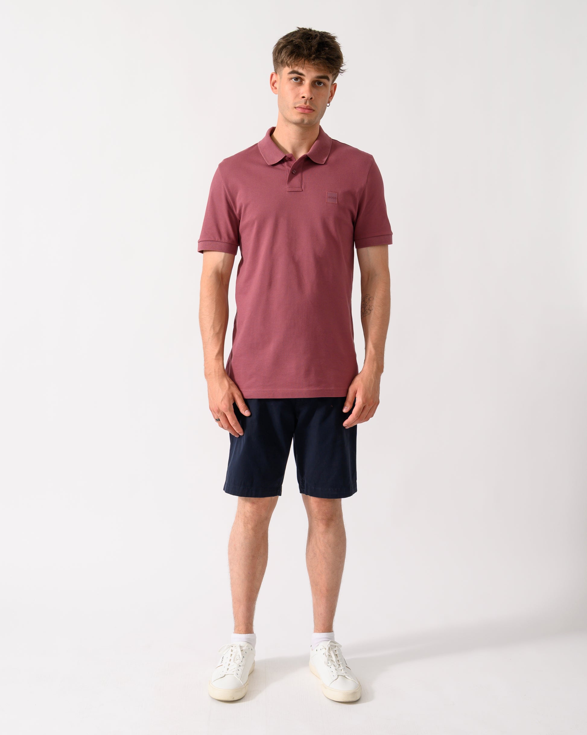full length shot of model wearing a pair of BOSS Orange Slim Fit Mens Chino Shorts in Dark Blue 404