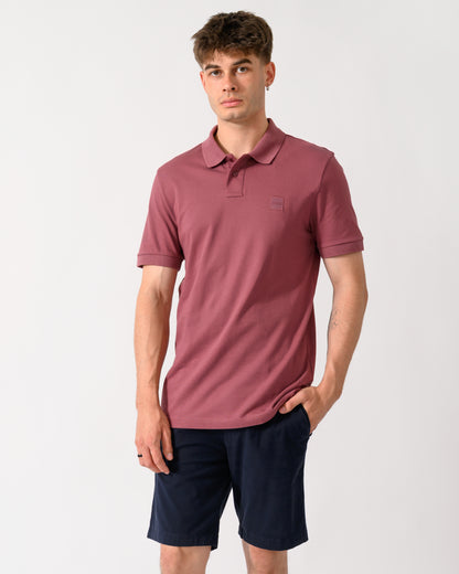 model wearing a BOSS Orange Passenger Mens Stretch-Cotton Slim-Fit Polo Shirt with Logo Patch in Medium Red 618