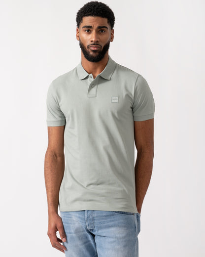 Model wearing a BOSS Orange Passenger Mens Stretch-Cotton Slim-Fit Polo Shirt with Logo Patch in Open Green