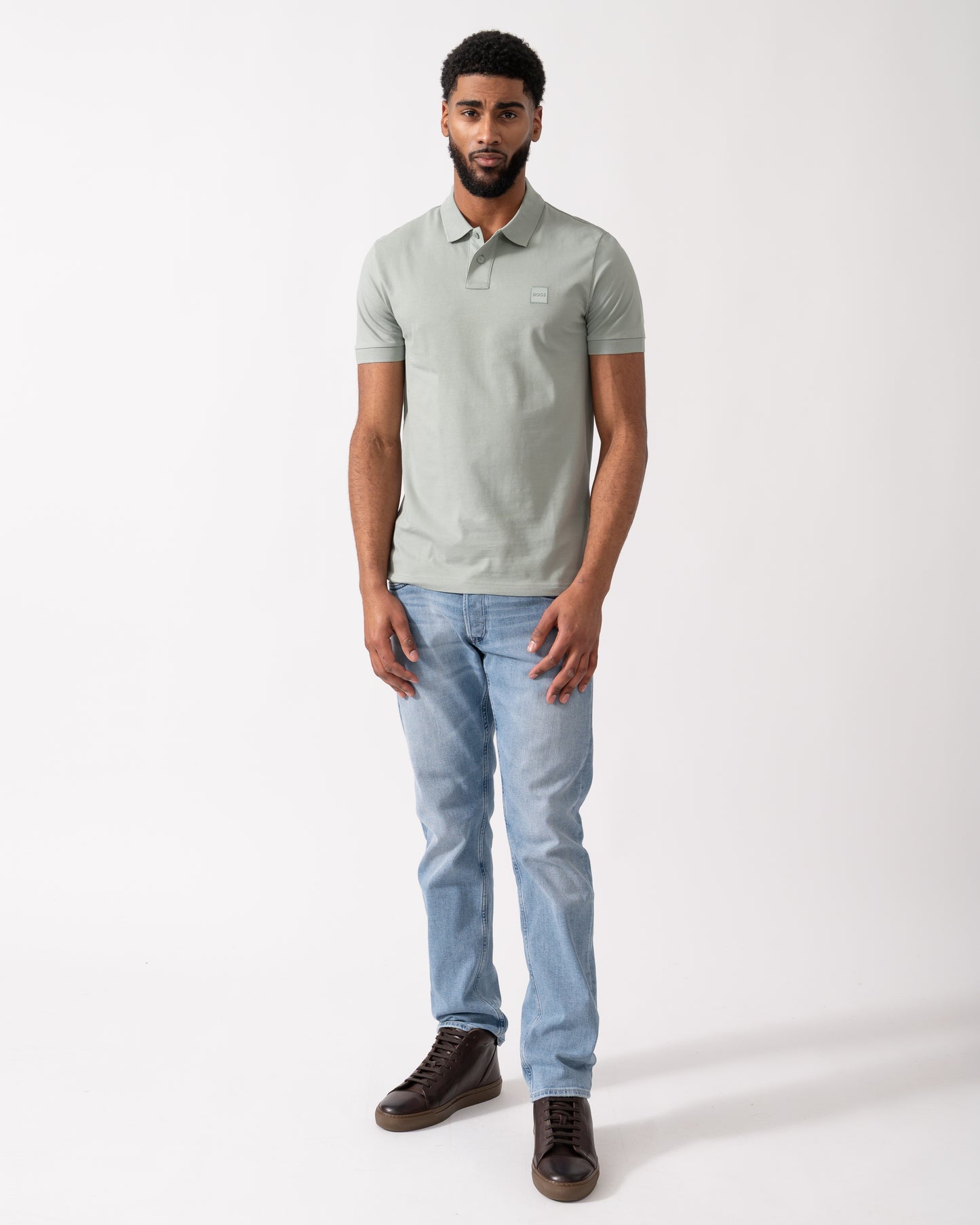 full length shot of a Model wearing a BOSS Orange Passenger Mens Stretch-Cotton Slim-Fit Polo Shirt with Logo Patch in Open Green