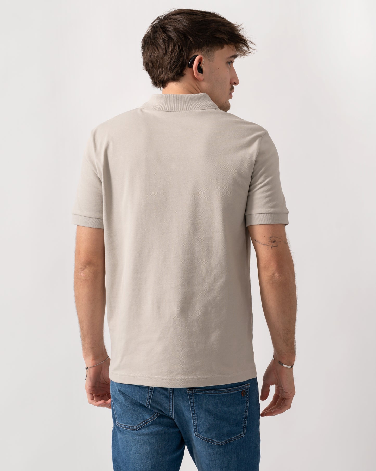 back shot of a model wearing a BOSS Orange Passenger Mens Stretch-Cotton Slim-Fit Polo Shirt with Logo Patch in Open Grey 070