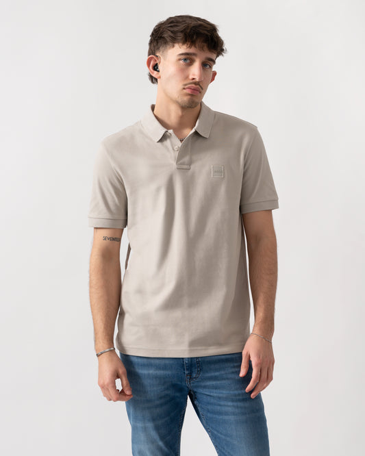 studio shot of a model wearing a BOSS Orange Passenger Mens Stretch-Cotton Slim-Fit Polo Shirt with Logo Patch in Open Grey 070