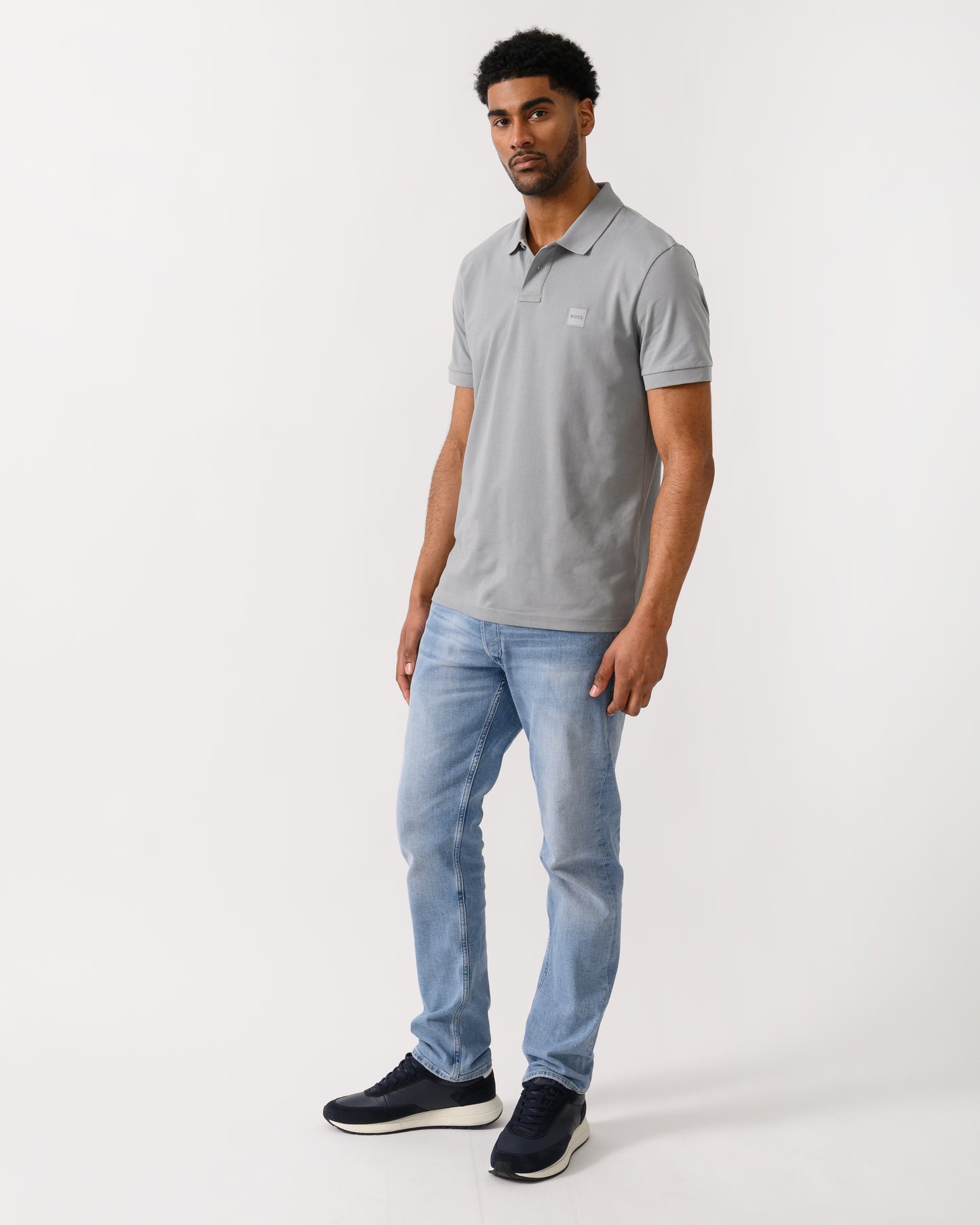 full length shot of a model wearing a BOSS Orange Passenger Mens Stretch-Cotton Slim-Fit Polo Shirt with Logo Patch in Silver 047