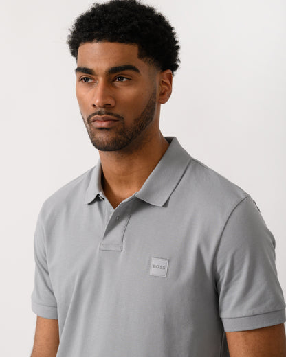 close up shot of a model wearing a BOSS Orange Passenger Mens Stretch-Cotton Slim-Fit Polo Shirt with Logo Patch in Silver 047