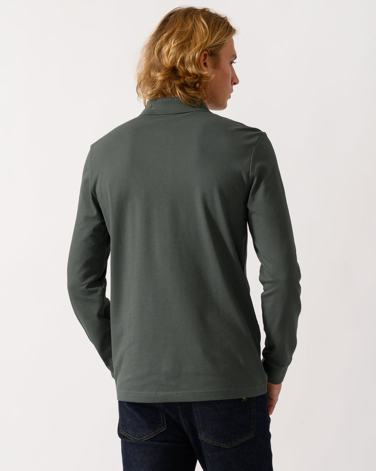 back of a model wearing a BOSS Orange Passerby Mens Long Sleeve Stretch-Cotton Polo Shirt with Logo Patch in Open Green 377