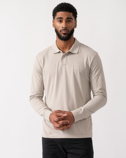 model wearing a BOSS Orange Passerby Mens Long Sleeve Stretch-Cotton Polo Shirt with Logo Patch in Open Grey