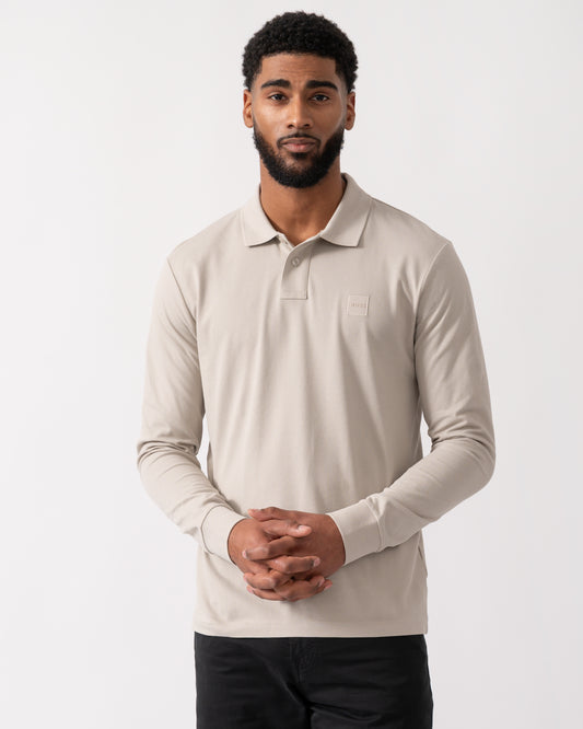model wearing a BOSS Orange Passerby Mens Long Sleeve Stretch-Cotton Polo Shirt with Logo Patch in Open Grey