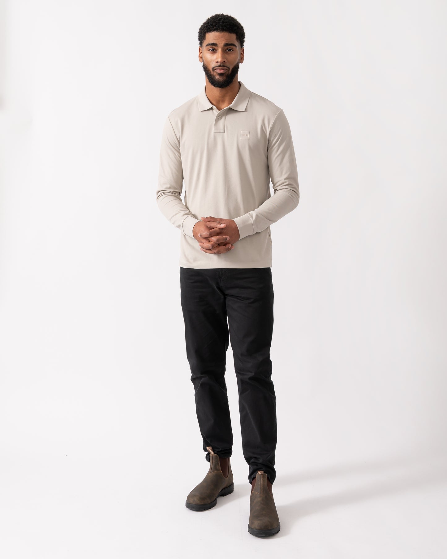 full length shot of a model wearing a BOSS Orange Passerby Mens Long Sleeve Stretch-Cotton Polo Shirt with Logo Patch in Open Grey