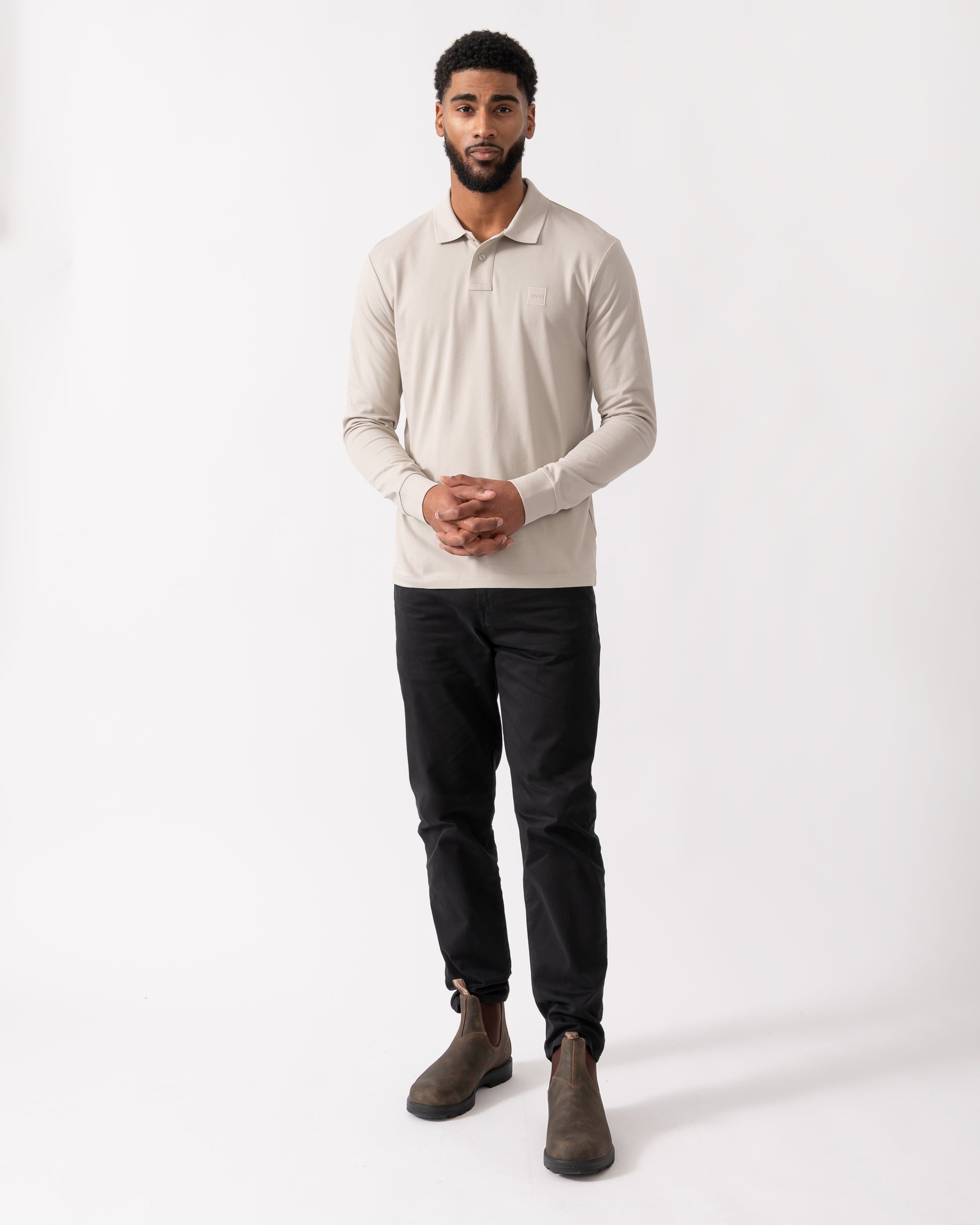 full length shot of a model wearing a BOSS Orange Passerby Mens Long Sleeve Stretch-Cotton Polo Shirt with Logo Patch in Open Grey