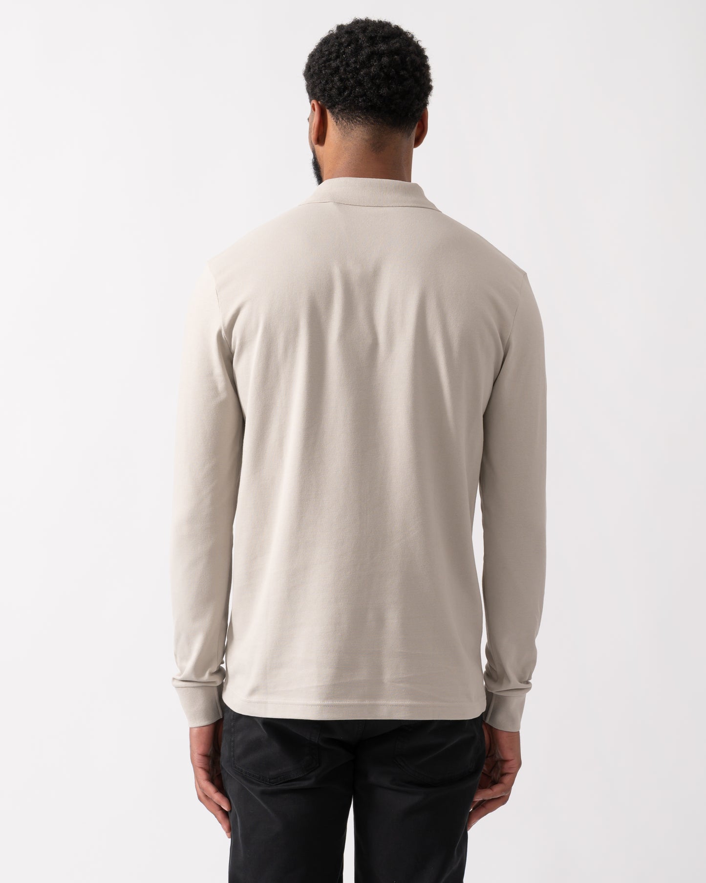 back shot of a model wearing a BOSS Orange Passerby Mens Long Sleeve Stretch-Cotton Polo Shirt with Logo Patch in Open Grey