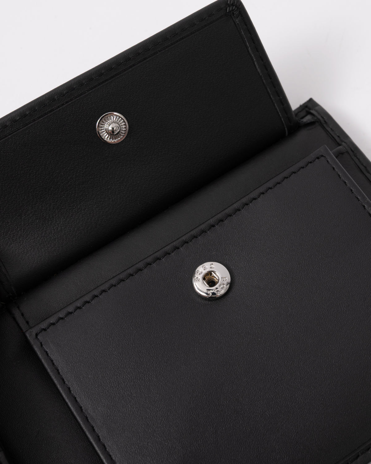 press stud detail of BOSS Orange Randy Mens Trifold Leather Wallet in Black 001