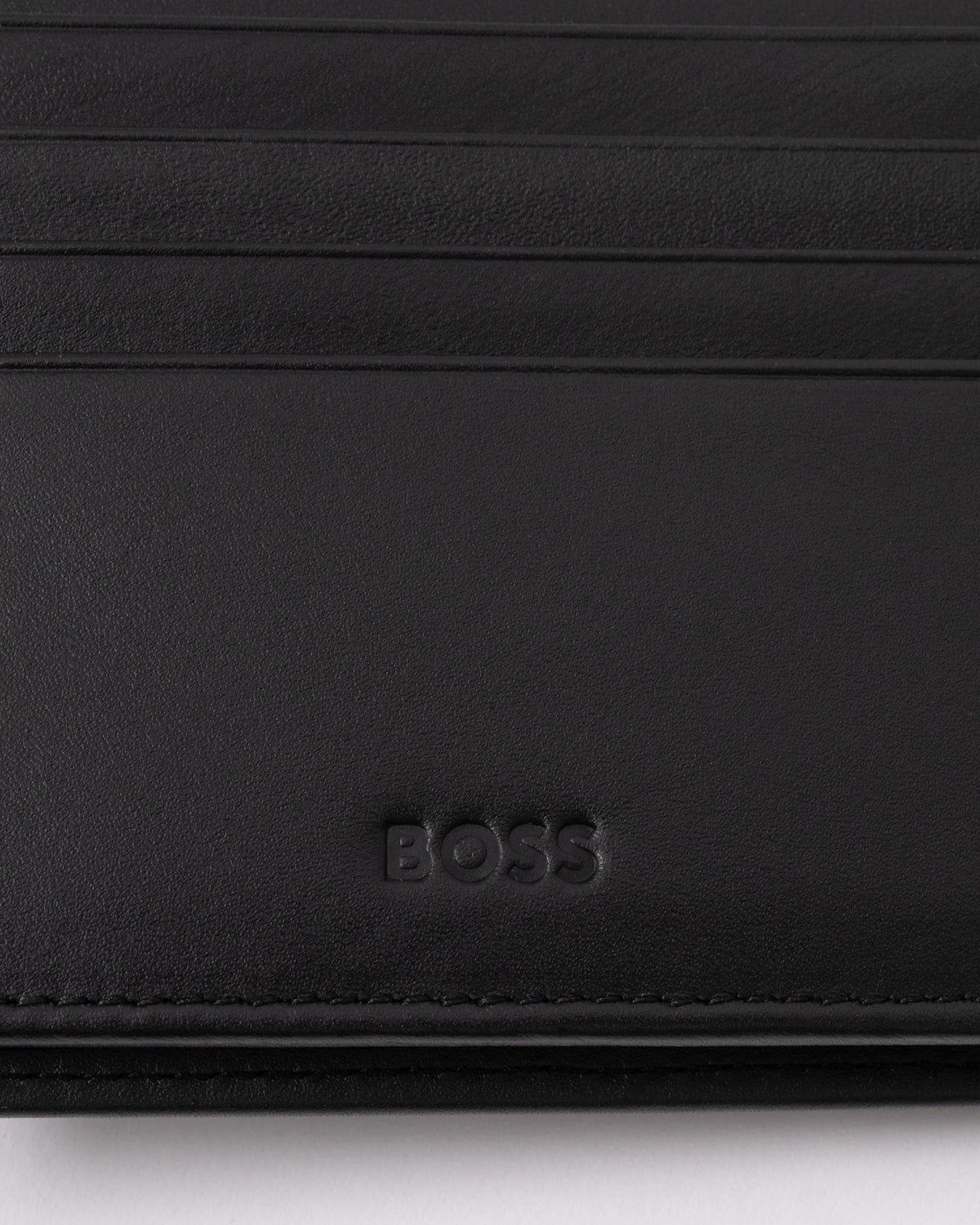 embossed interior logo detail of BOSS Orange Randy Mens Trifold Leather Wallet in Black 001