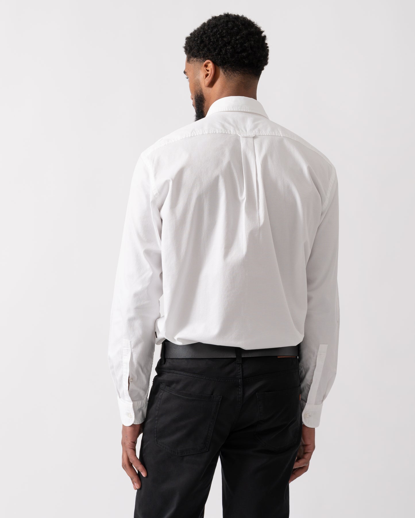 Back shot of a model wearing a BOSS Orange Rickert Mens Shirt in Natural colourway