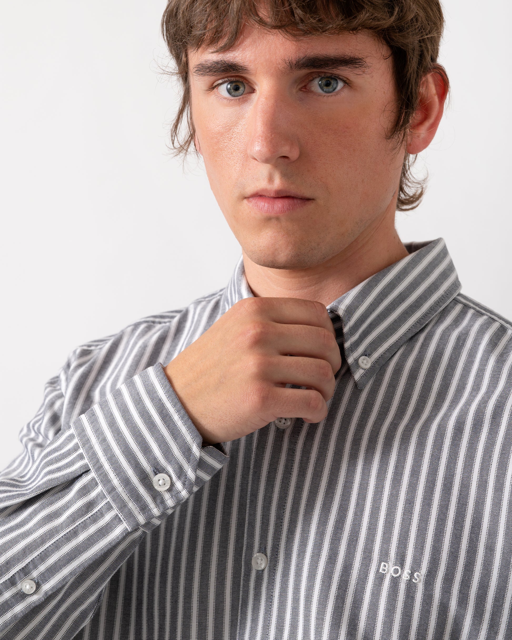 close up of model wearing a BOSS Orange Ricoplus Mens Long Sleeve Oxford Shirt in Dark Blue 404