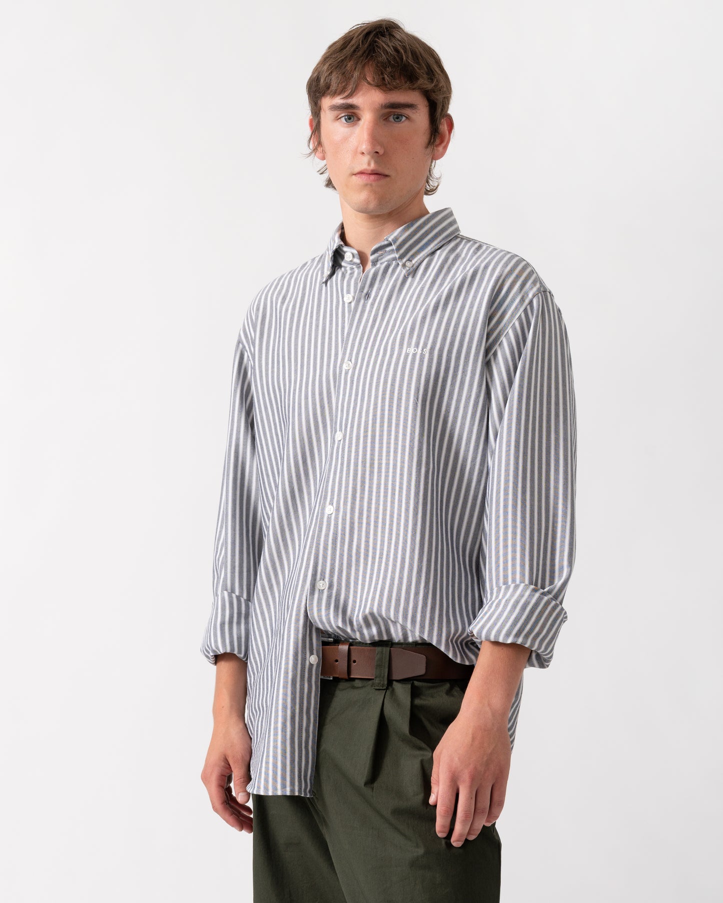 model wearing a BOSS Orange Ricoplus Mens Long Sleeve Oxford Shirt in Dark Blue 404