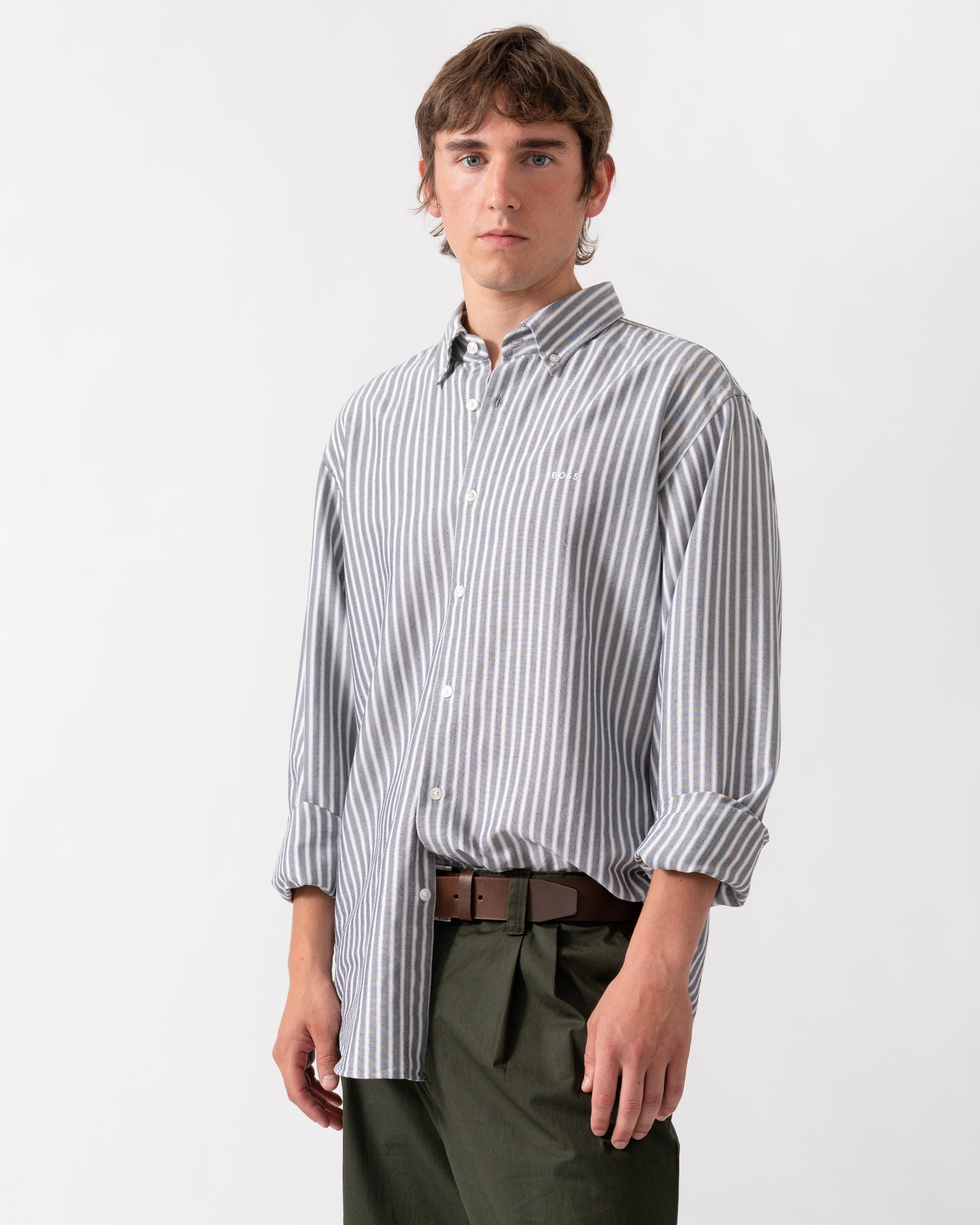 model wearing a BOSS Orange Ricoplus Mens Long Sleeve Oxford Shirt in Dark Blue 404