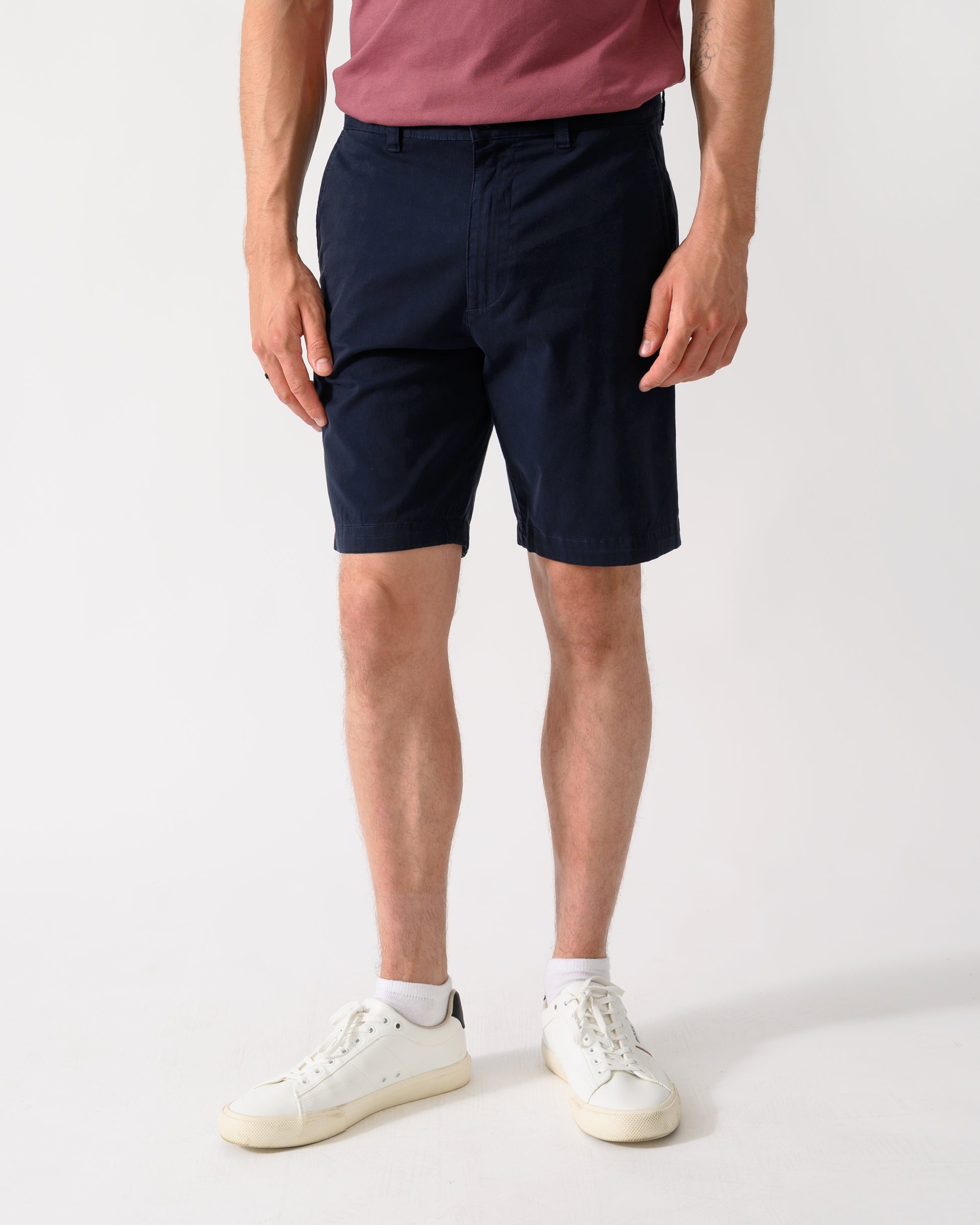 model wearing a pair of BOSS Orange Slim Fit Mens Chino Shorts in Dark Blue 404