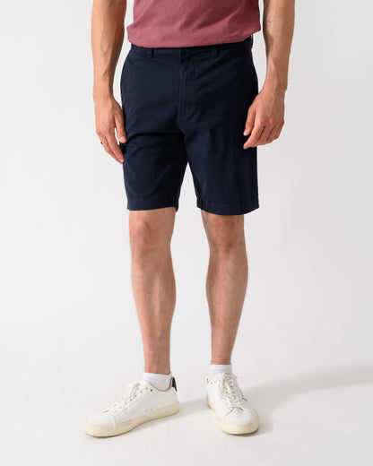 model wearing a pair of BOSS Orange Slim Fit Mens Chino Shorts in Dark Blue 404