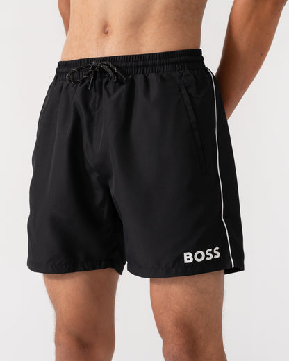 close up of a model wearing a pair of BOSS Orange Starfish Mens Swim Shorts in Black 001