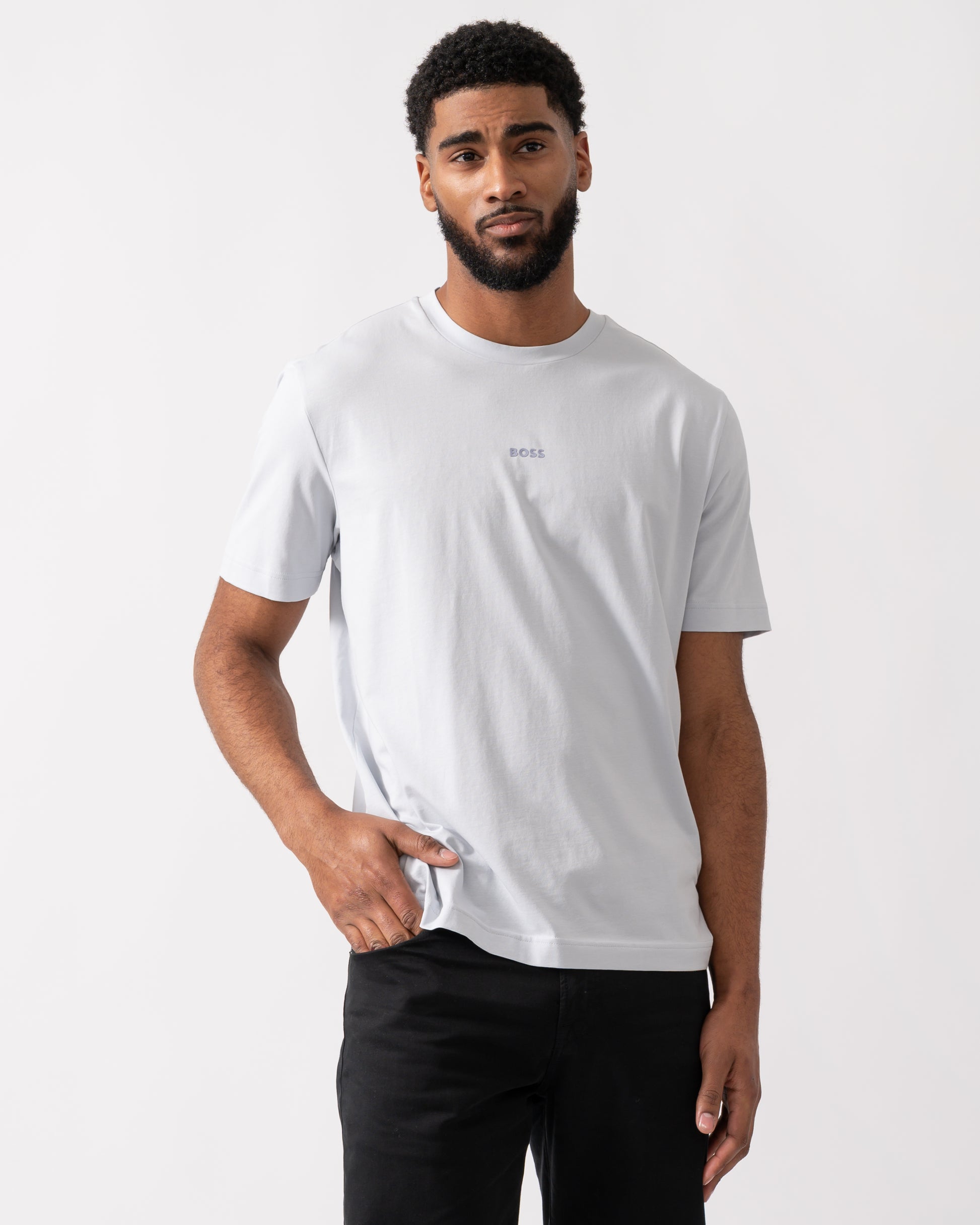 model wearing a BOSS Orange TChup Mens Crew Neck Small Logo T-Shirt in Light-Pastel Grey