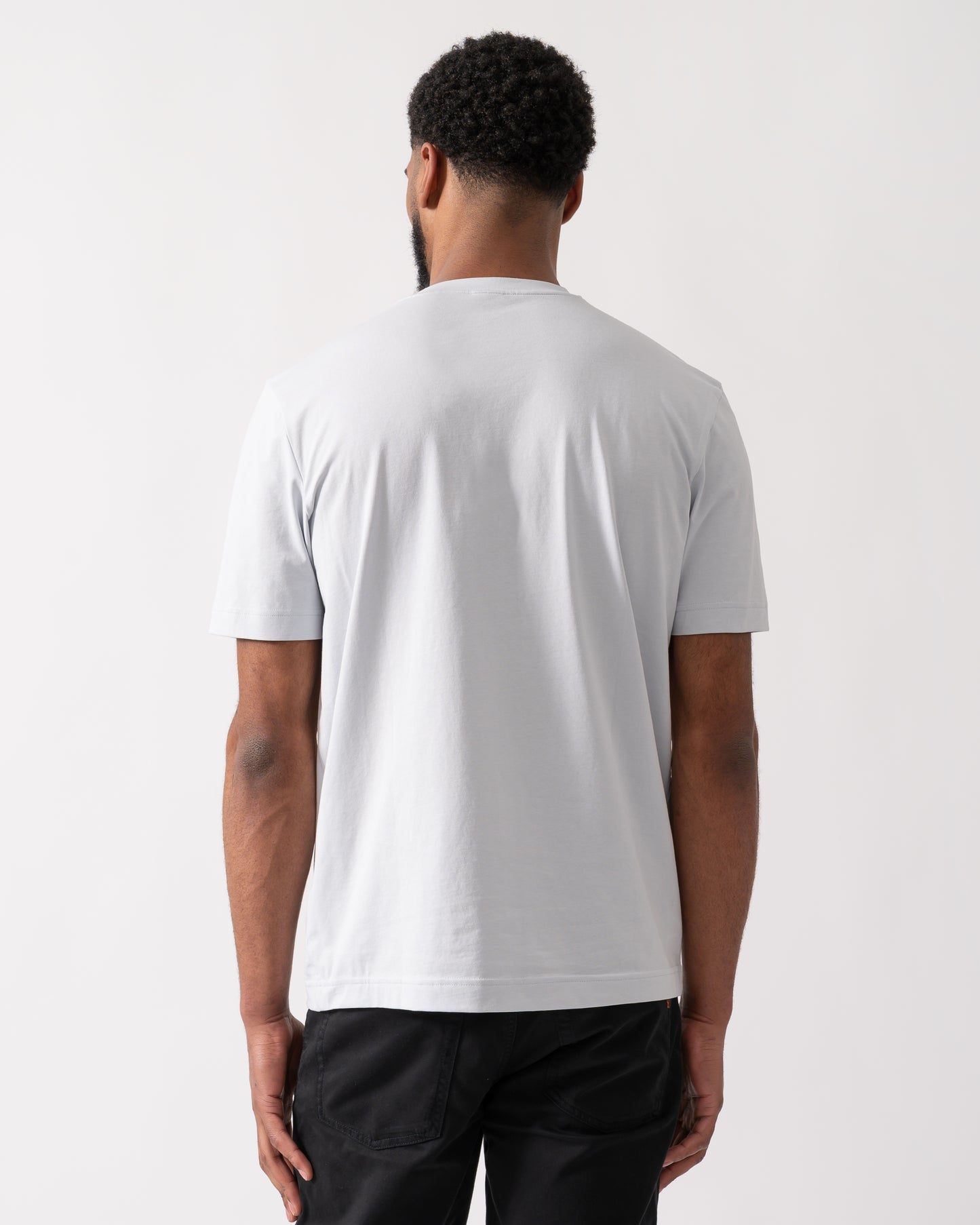 back shot of a model wearing a BOSS Orange TChup Mens Crew Neck Small Logo T-Shirt in Light-Pastel Grey