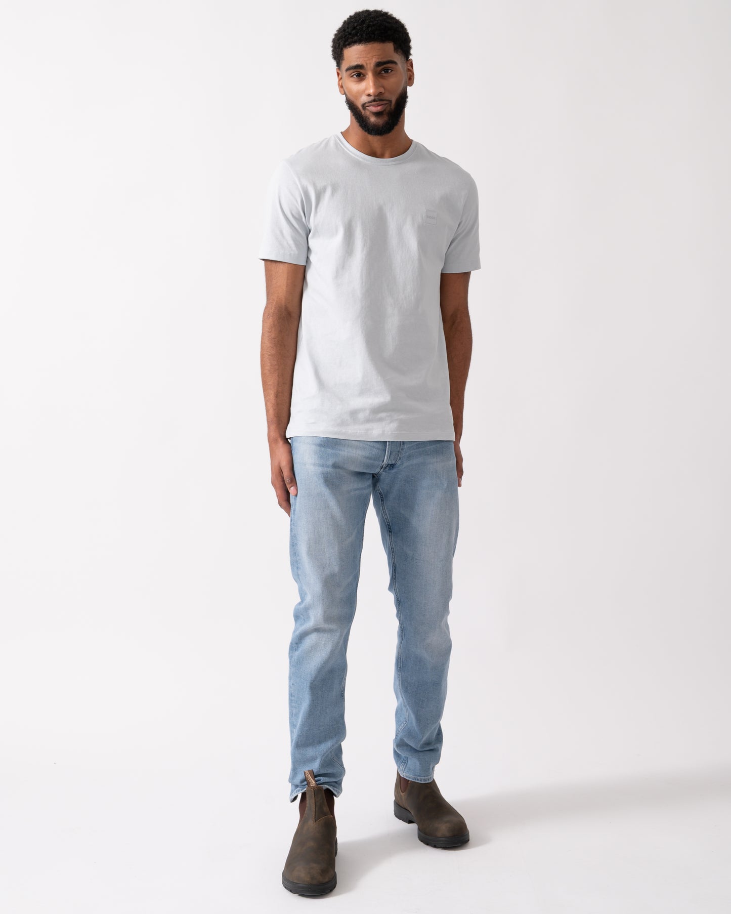 full length shot of a model wearing a BOSS Orange Tales Mens Cotton-Jersey T-shirt With Logo Patch in Light-Pastel Grey