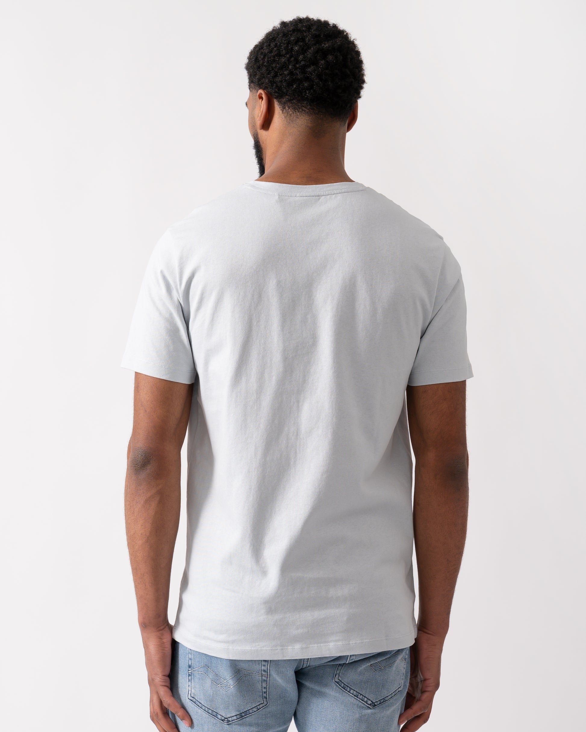 back shot of a model wearing a BOSS Orange Tales Mens Cotton-Jersey T-shirt With Logo Patch in Light-Pastel Grey