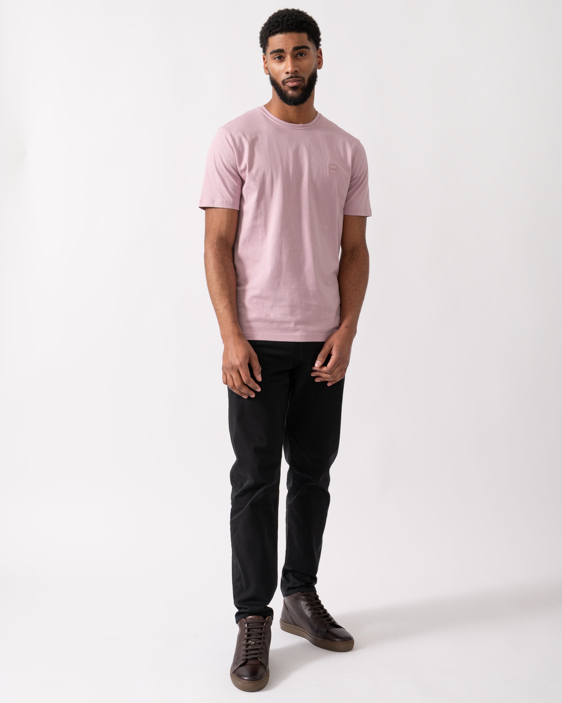 full length shot of a Model wearing a BOSS Orange Tales Mens Cotton-Jersey T-shirt With Logo Patch in Light Pastel Purple