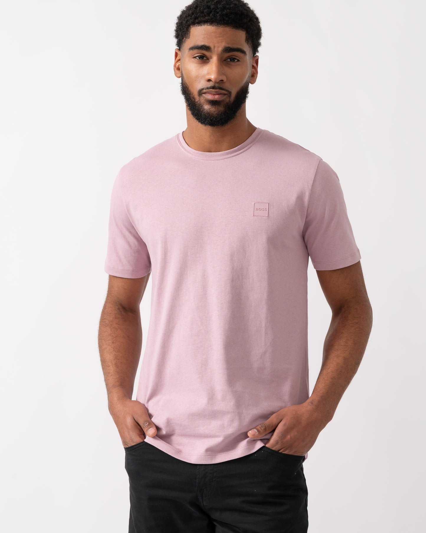 Model wearing a BOSS Orange Tales Mens Cotton-Jersey T-shirt With Logo Patch in Light Pastel Purple
