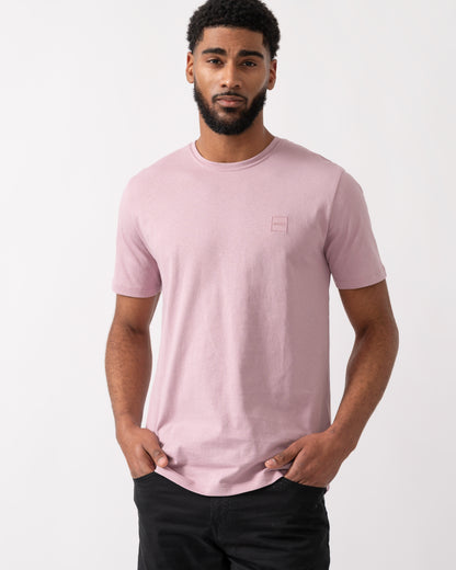 Model wearing a BOSS Orange Tales Mens Cotton-Jersey T-shirt With Logo Patch in Light Pastel Purple