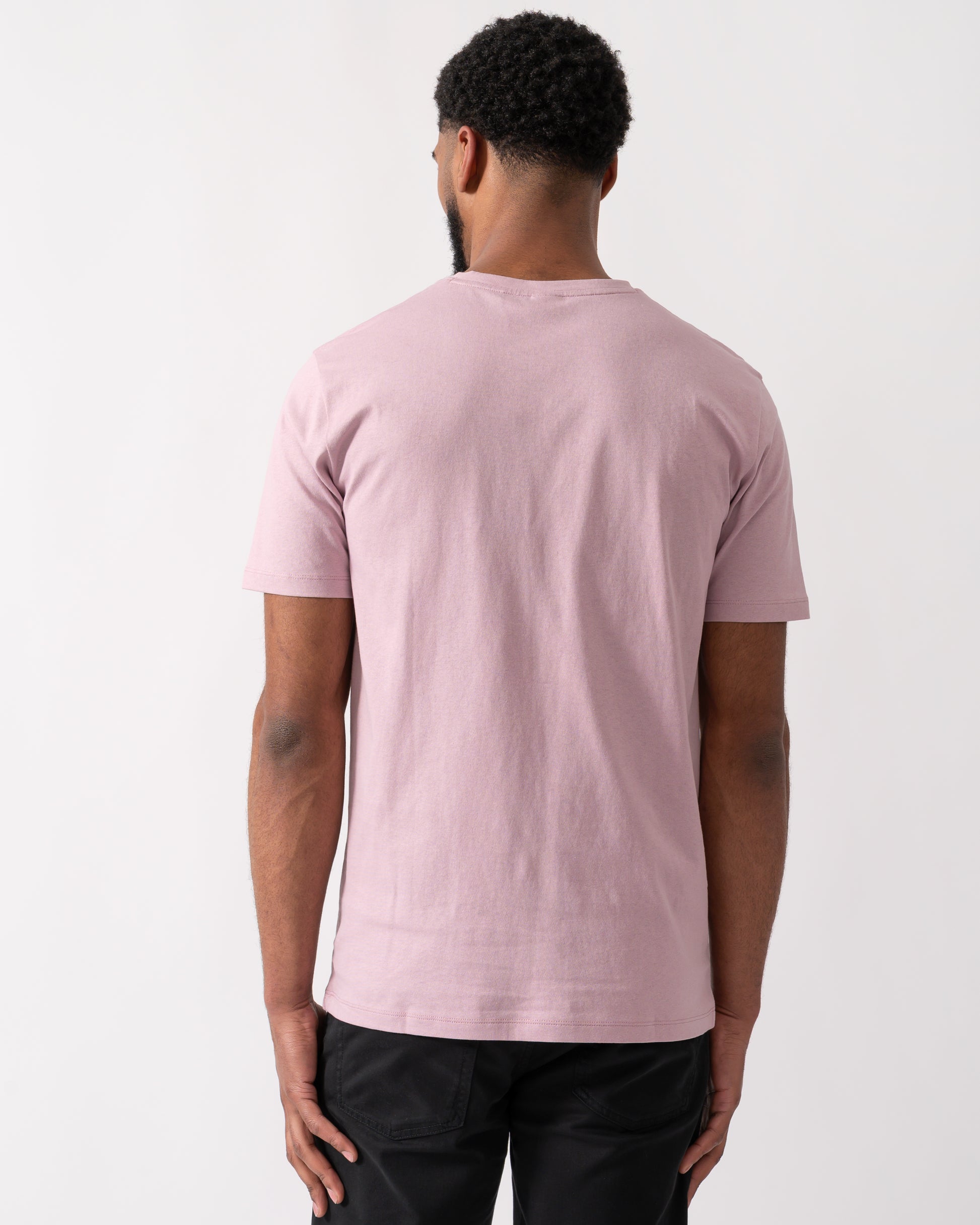 back shot of a Model wearing a BOSS Orange Tales Mens Cotton-Jersey T-shirt With Logo Patch in Light Pastel Purple