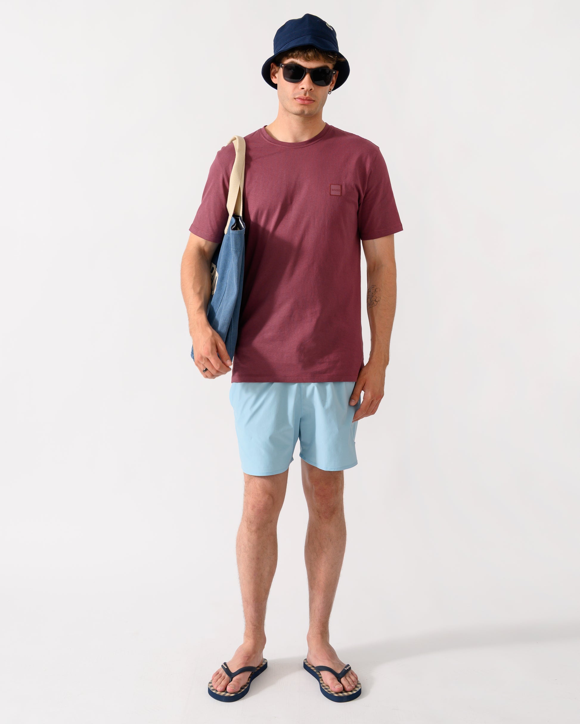 shot of a model wearing a BOSS Orange Tales Mens Cotton-Jersey T-shirt With Logo Patch in Medium Red 618