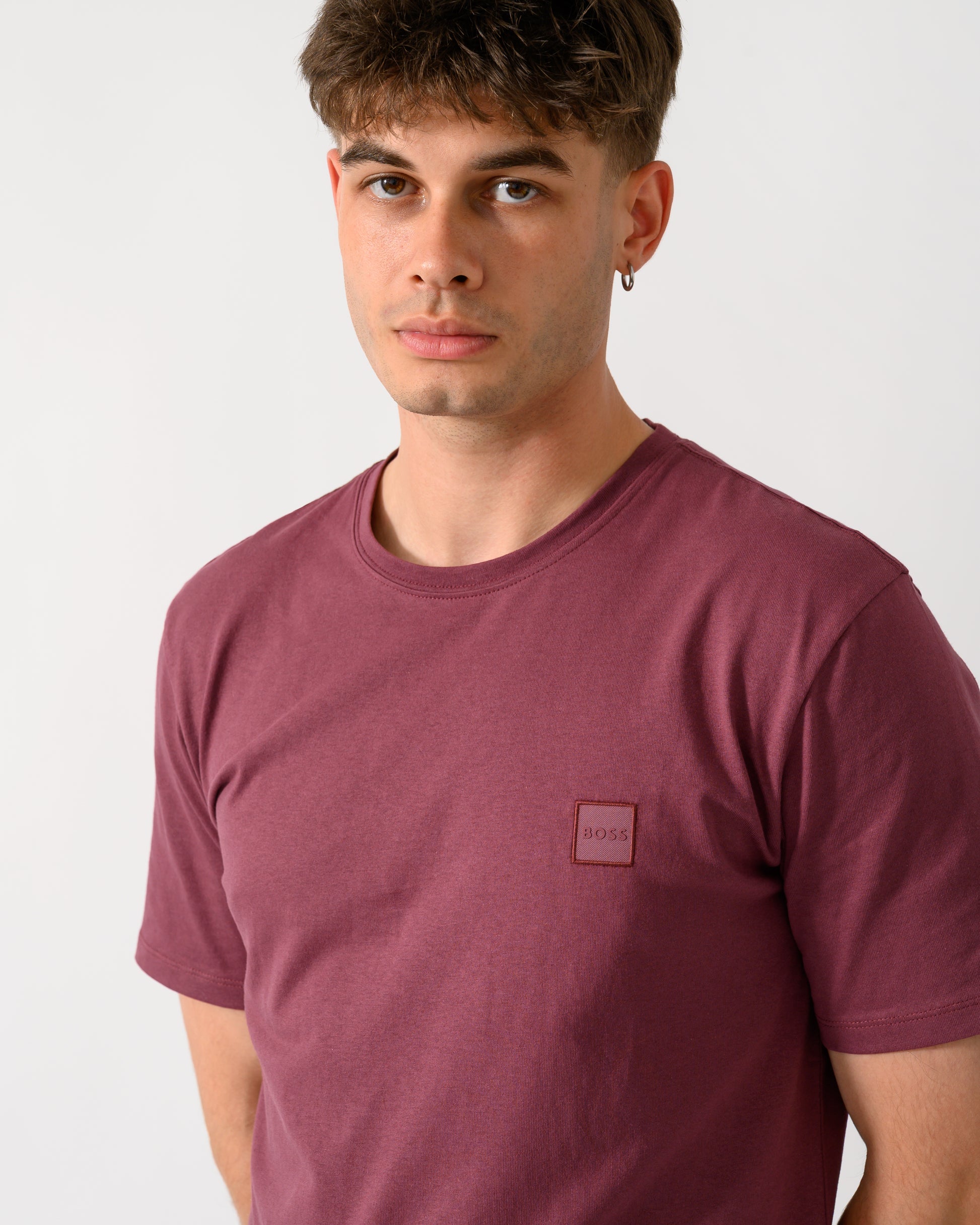 close up shot of a model wearing a BOSS Orange Tales Mens Cotton-Jersey T-shirt With Logo Patch in Medium Red 618