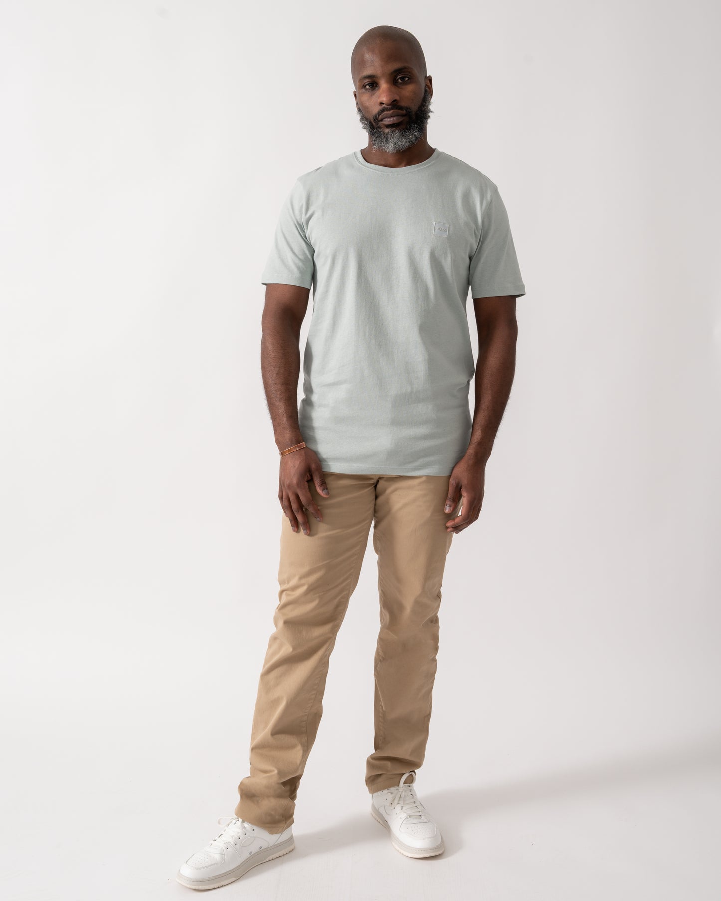 Full length shot of a model wearing a BOSS Orange Tales Mens Cotton-Jersey T-shirt With Logo Patch in Silver