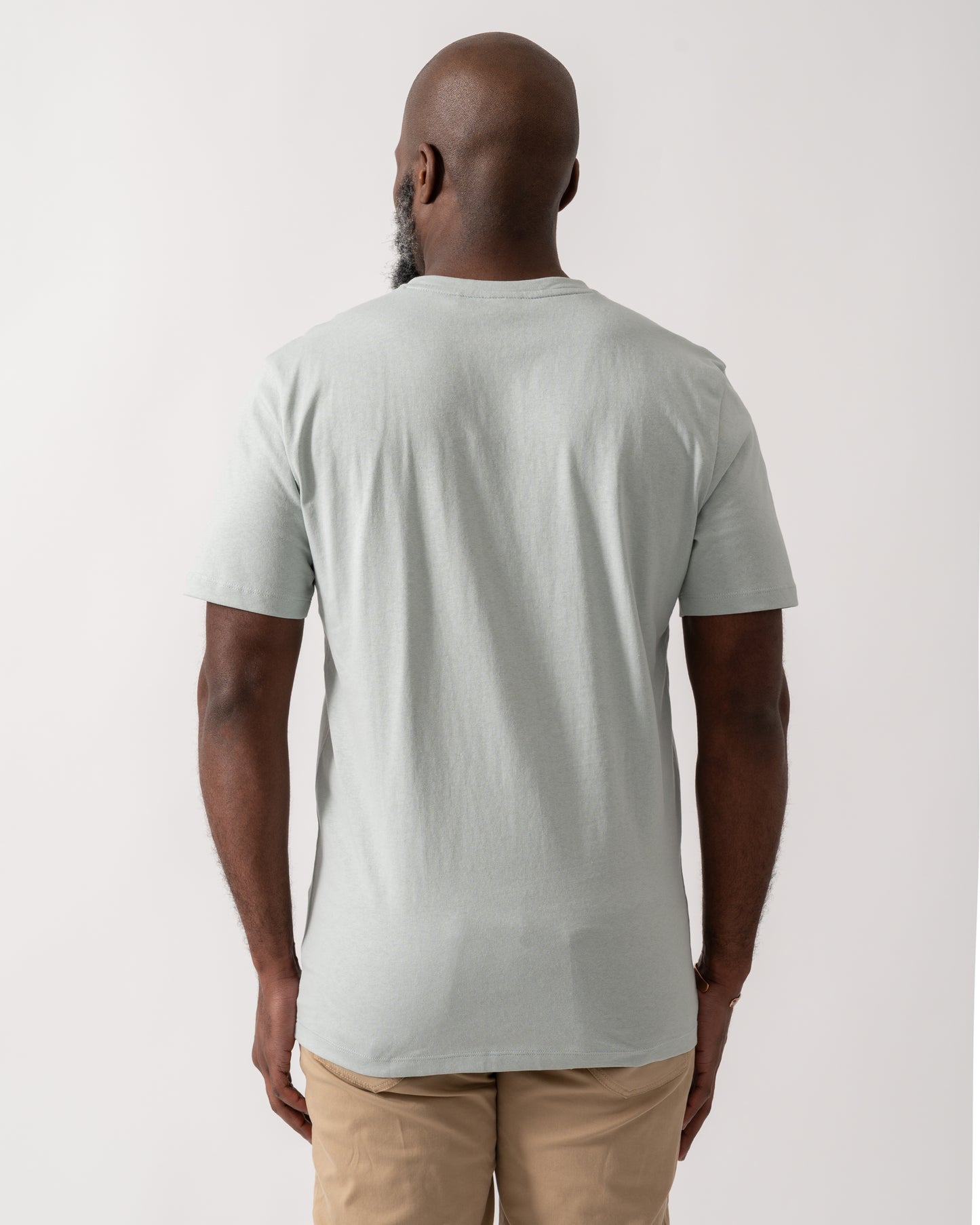 back shot of a model wearing a BOSS Orange Tales Mens Cotton-Jersey T-shirt With Logo Patch in Silver