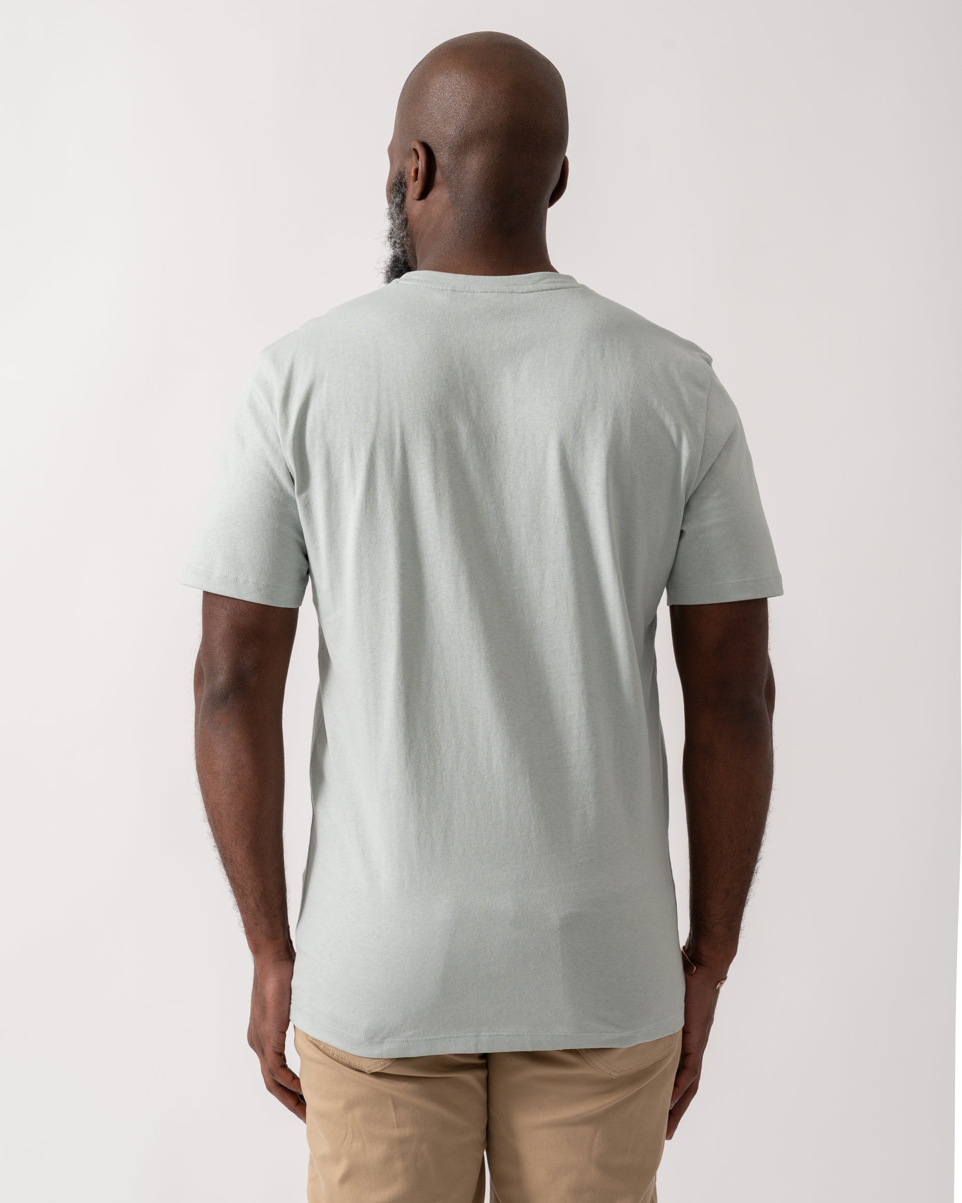 back shot of a model wearing a BOSS Orange Tales Mens Cotton-Jersey T-shirt With Logo Patch in Silver