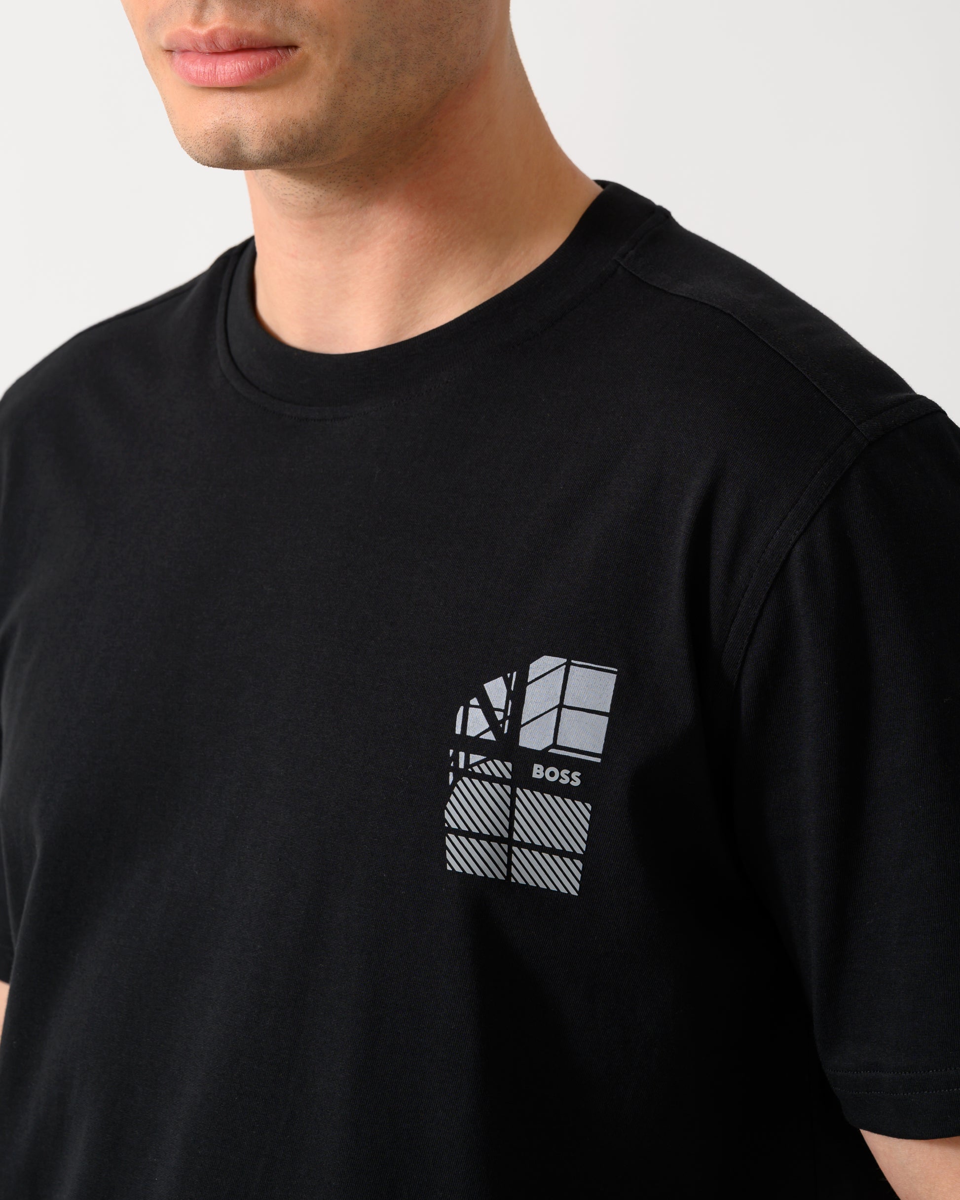 close up shot of a model wearing a BOSS Orange Te Blueprint Mens T-Shirt in Black 001