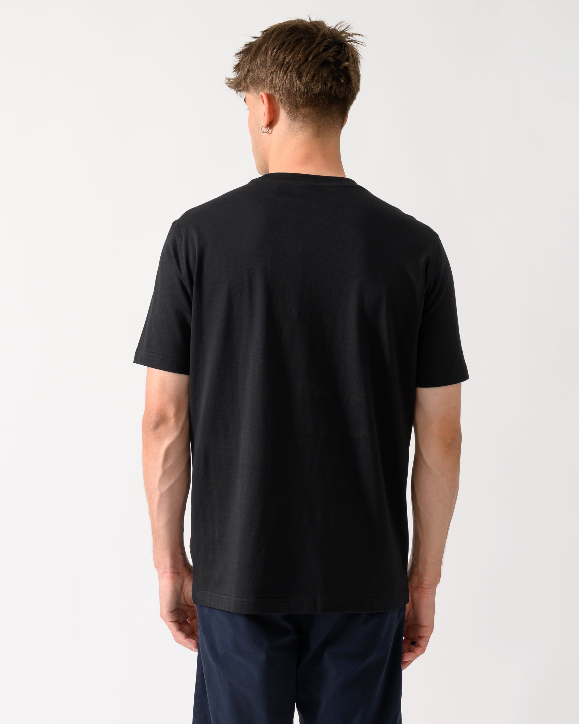 back shot of a model wearing a BOSS Orange Te Blueprint Mens T-Shirt in Black 001