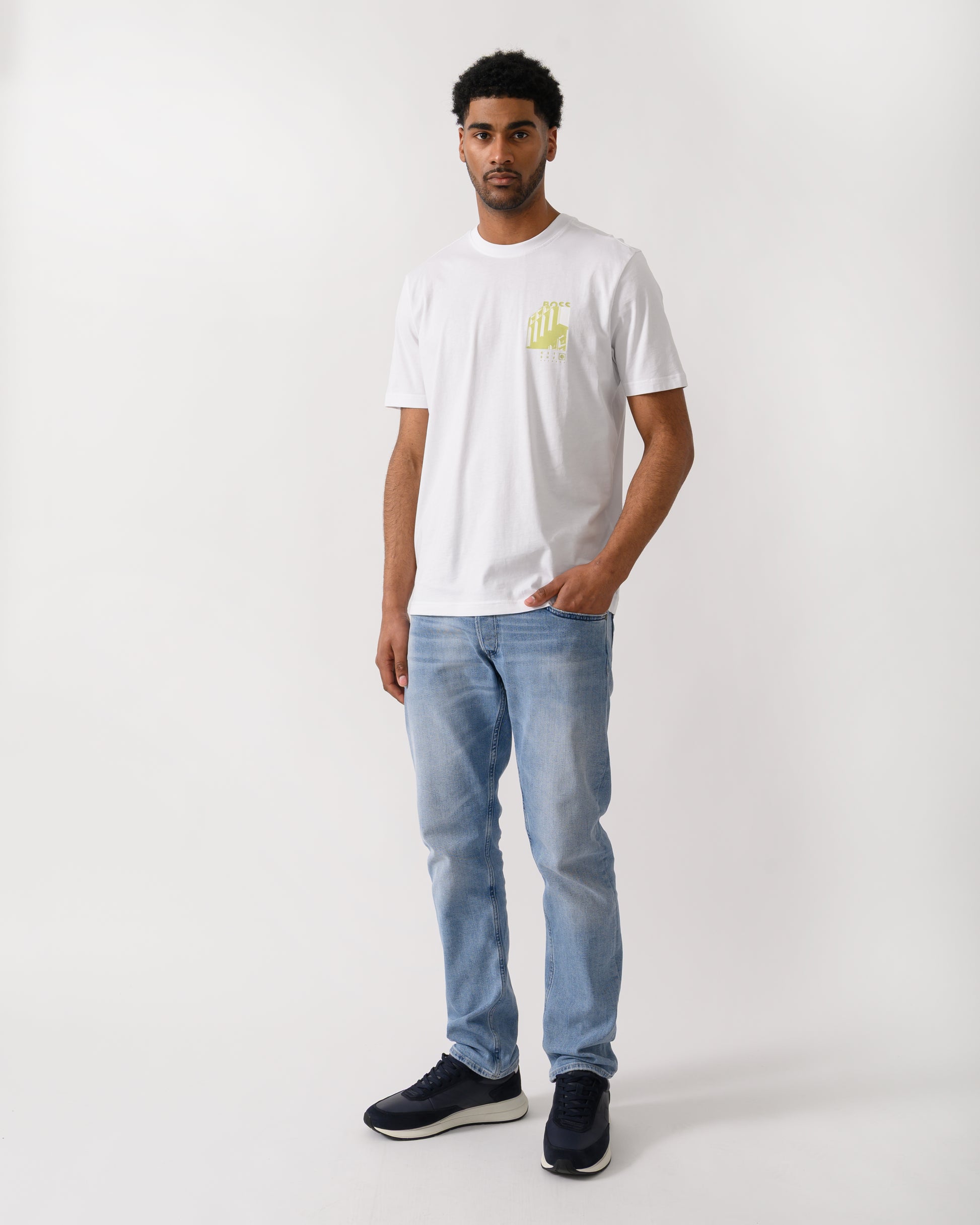 full length shot of a model wearing a BOSS Orange Te Board Mens T-Shirt in White 100