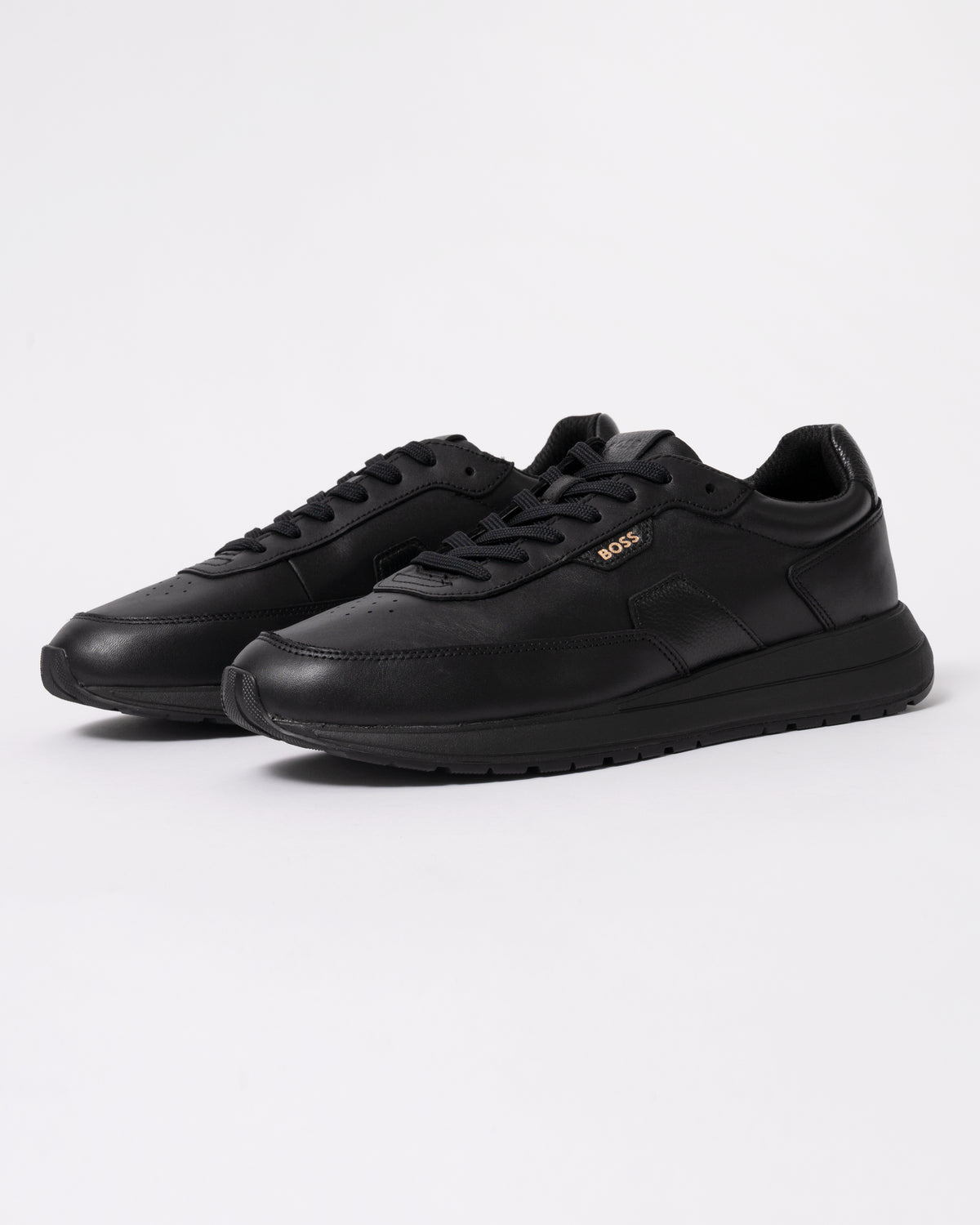 Studio photograph showing BOSS Orange Vinston_Runn_butb Mens Trainers in Black 005