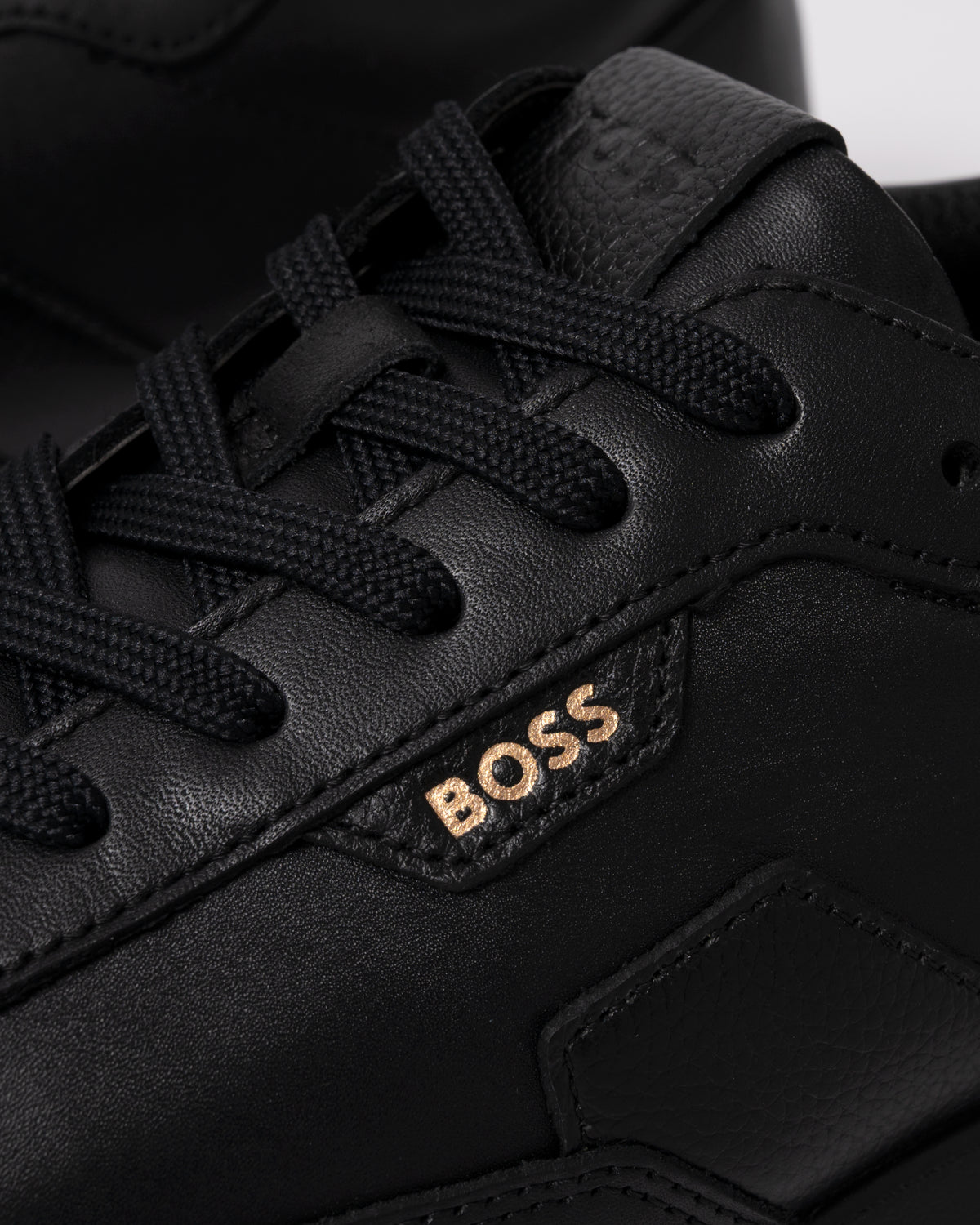 Studio photograph showing close up of BOSS Orange Vinston_Runn_butb Mens Trainers in Black 005