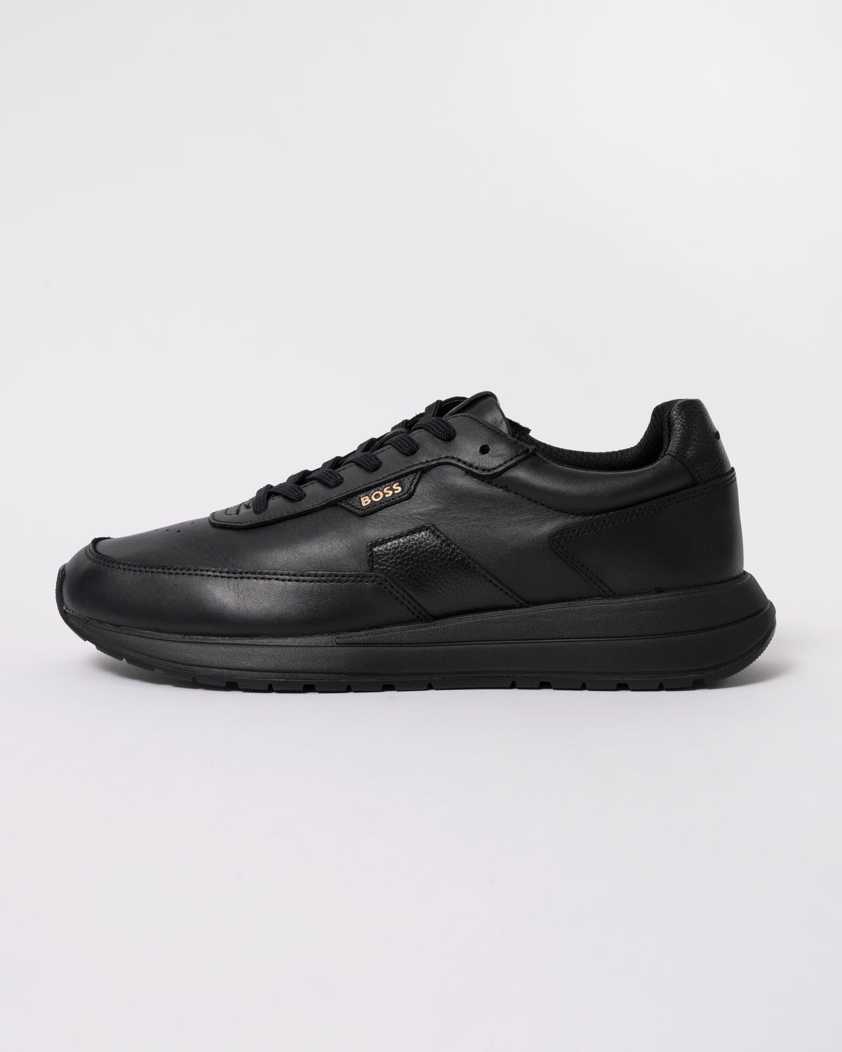 Studio photograph showing side of BOSS Orange Vinston_Runn_butb Mens Trainers in Black 005
