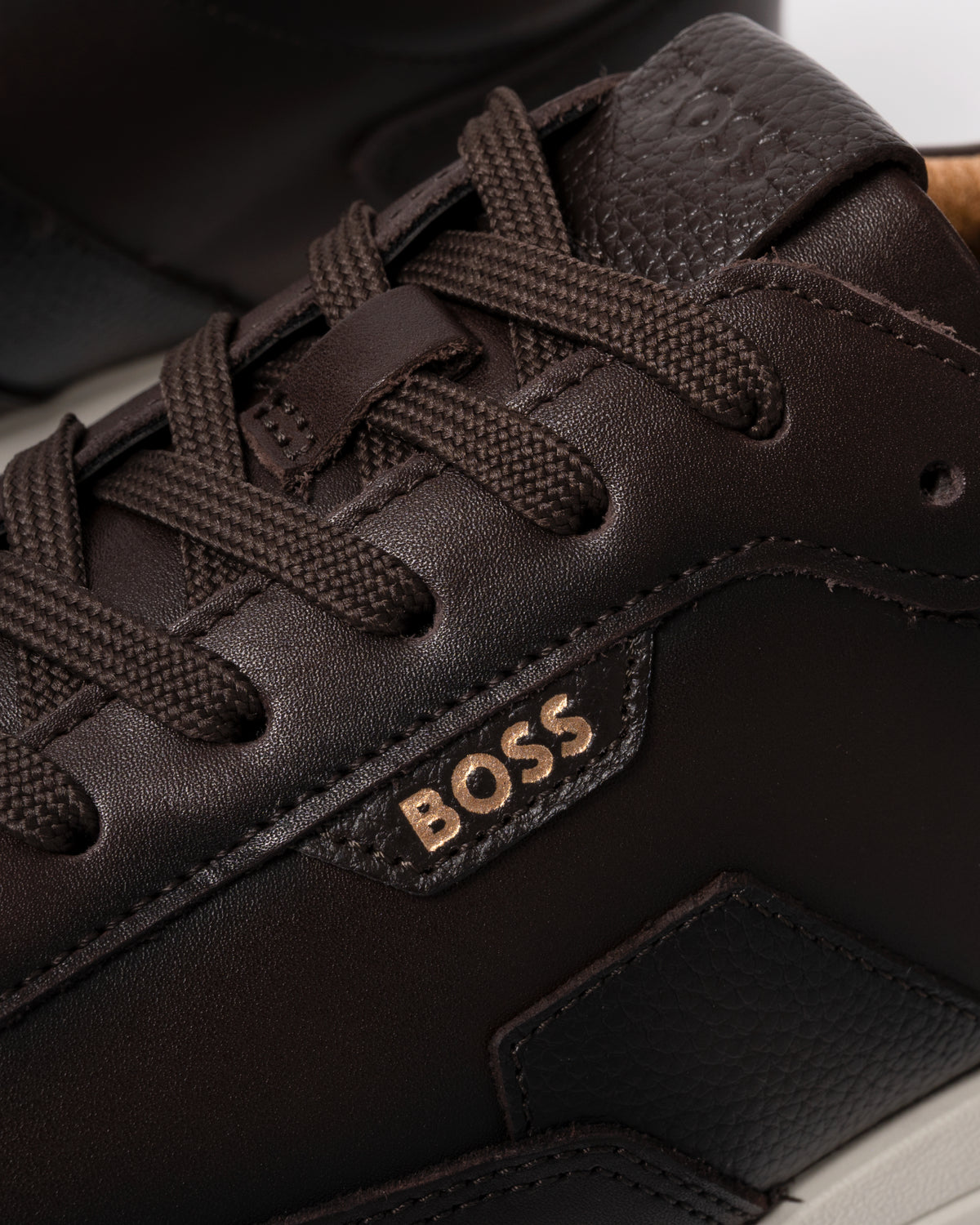 Studio photograph showing close up of BOSS Orange Vinston_Runn_butb Mens Trainers in Dark Brown 201