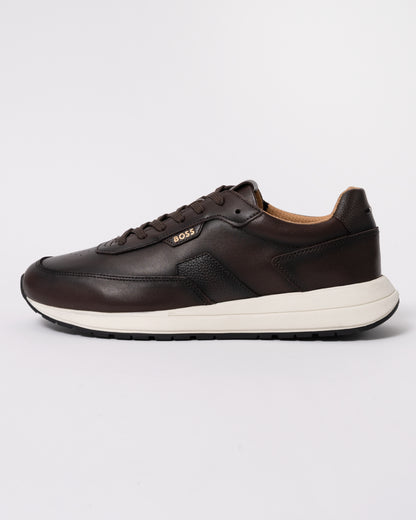 Studio photograph showing side of BOSS Orange Vinston_Runn_butb Mens Trainers in Dark Brown 201