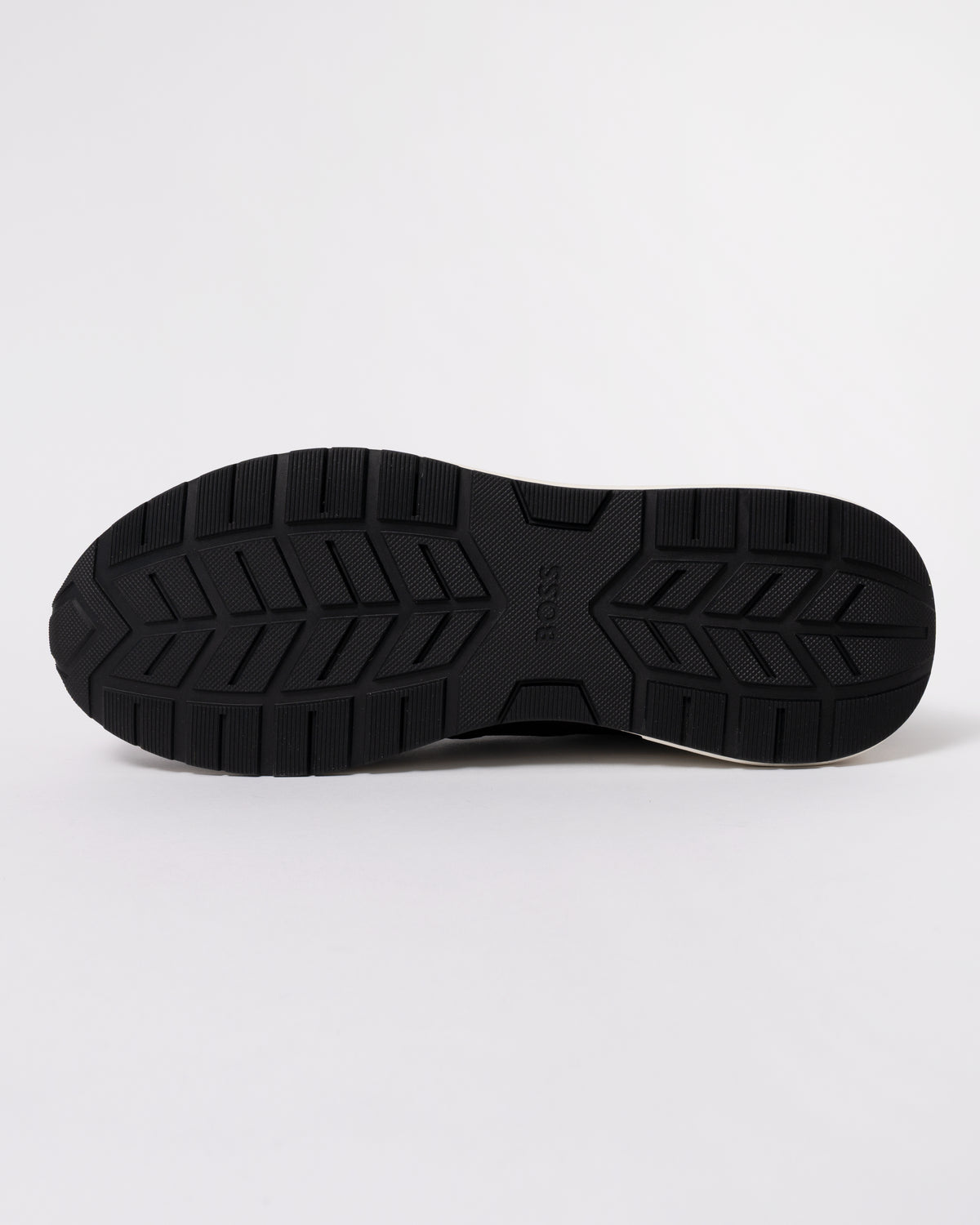 Studio photograph showing sole of BOSS Orange Vinston_Runn_butb Mens Trainers in Dark Brown 201