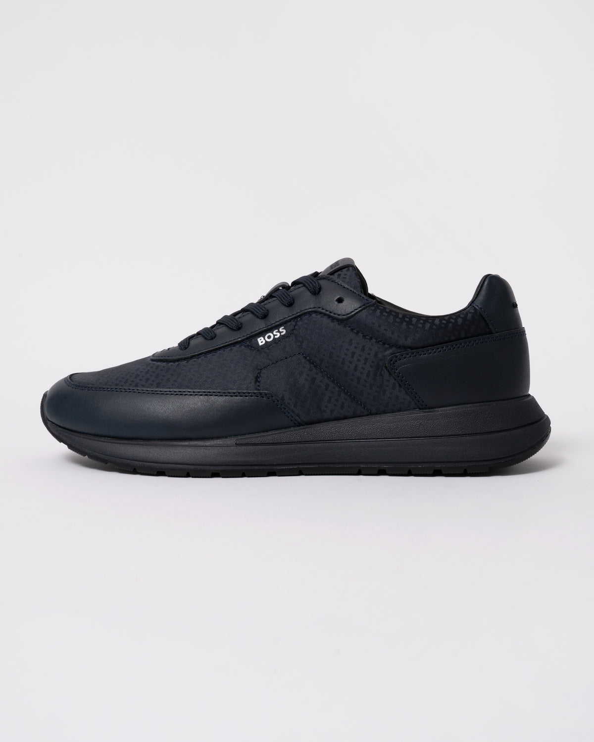 Studio photograph showing side of BOSS Orange Vinston_Runn_nymnlt Mens Trainers in Dark Blue 405